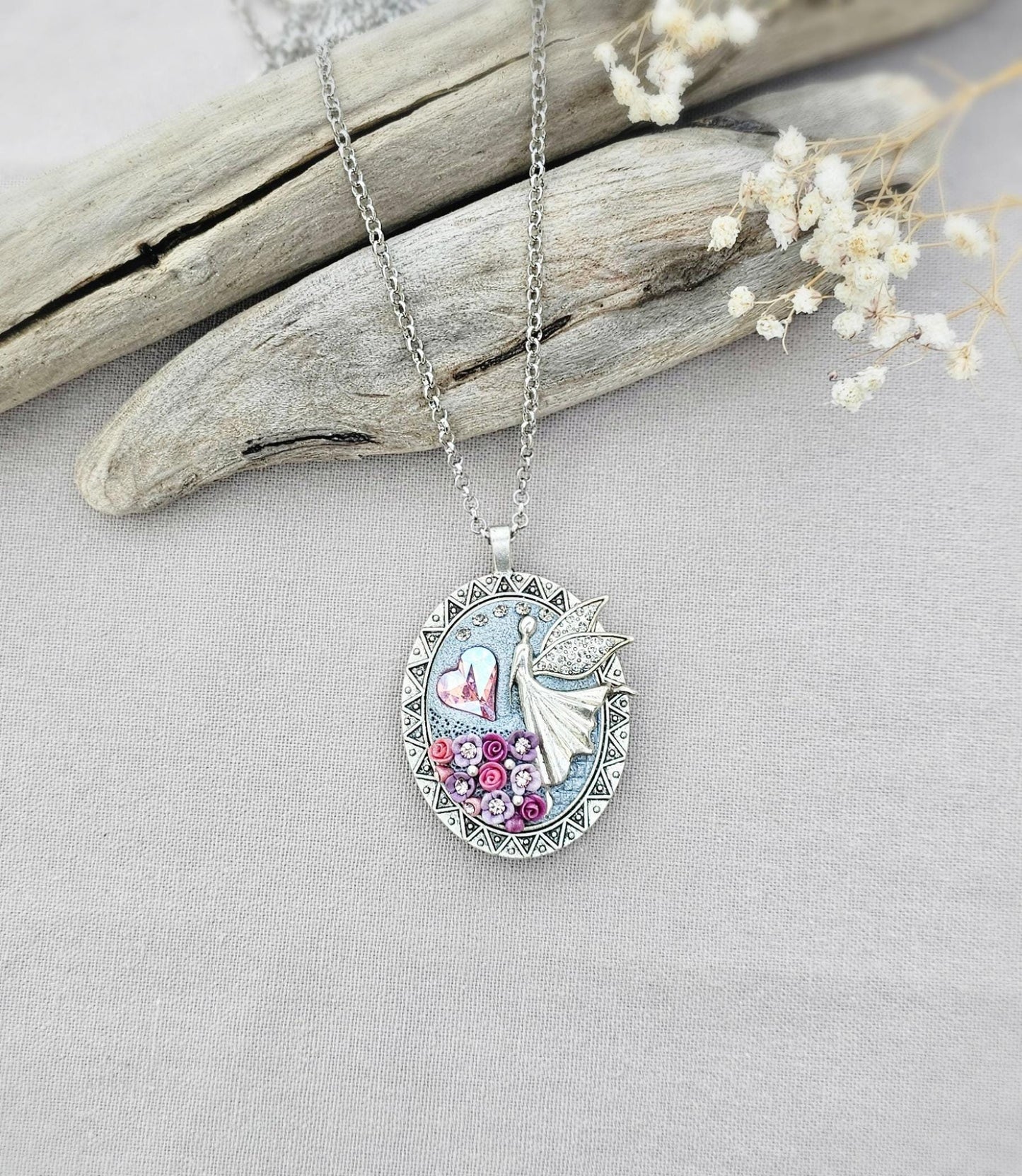 lavender fairy pendant, soft pink locket, fairy jewelry, silver chain necklace, photo locket, aromatic locket, handcrafted flowers, unique gift, whimsical charm, magical necklace, elegant jewelry, fairy tale locket, polymer clay pendant