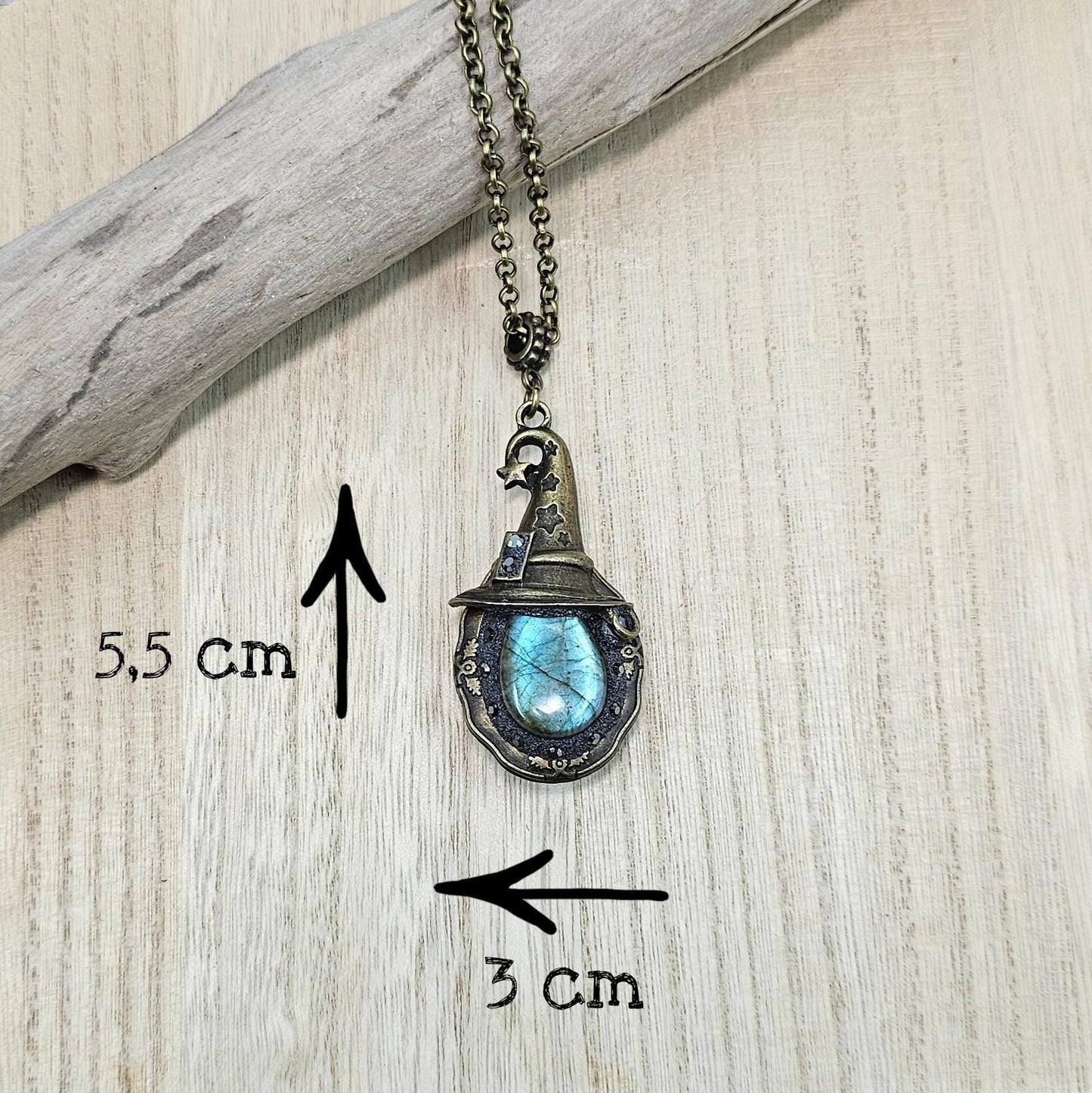 A magical pendant featuring a wizard’s hat, a stunning labradorite stone, and a hidden locket on the other side. Say “Abracadabra” and let your wishes come true!