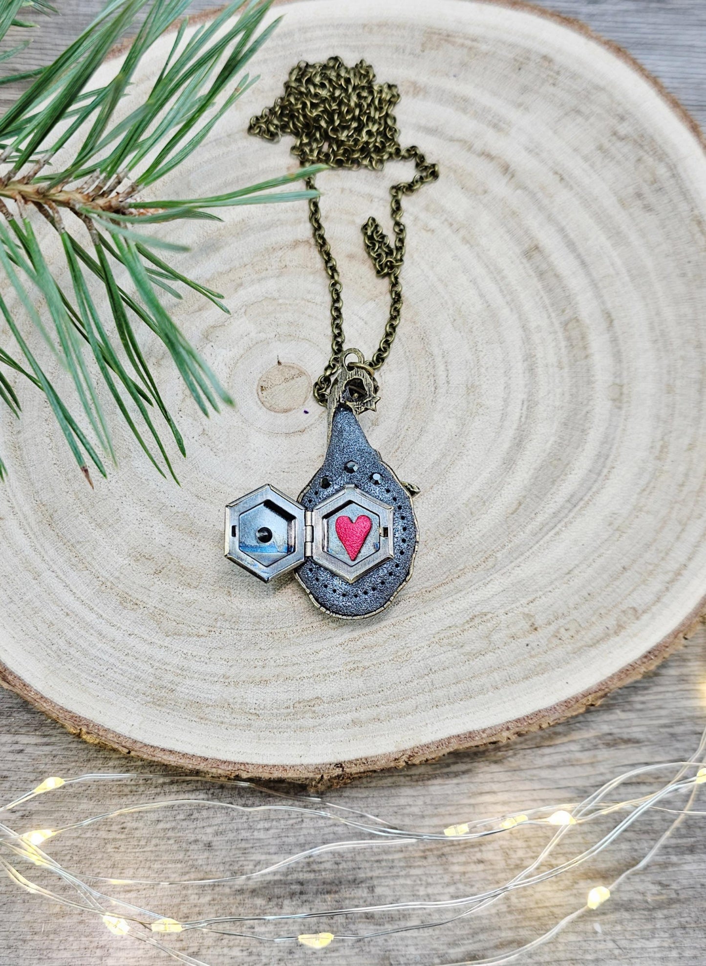 A magical pendant featuring a wizard’s hat, a stunning labradorite stone, and a hidden locket on the other side. Say “Abracadabra” and let your wishes come true!