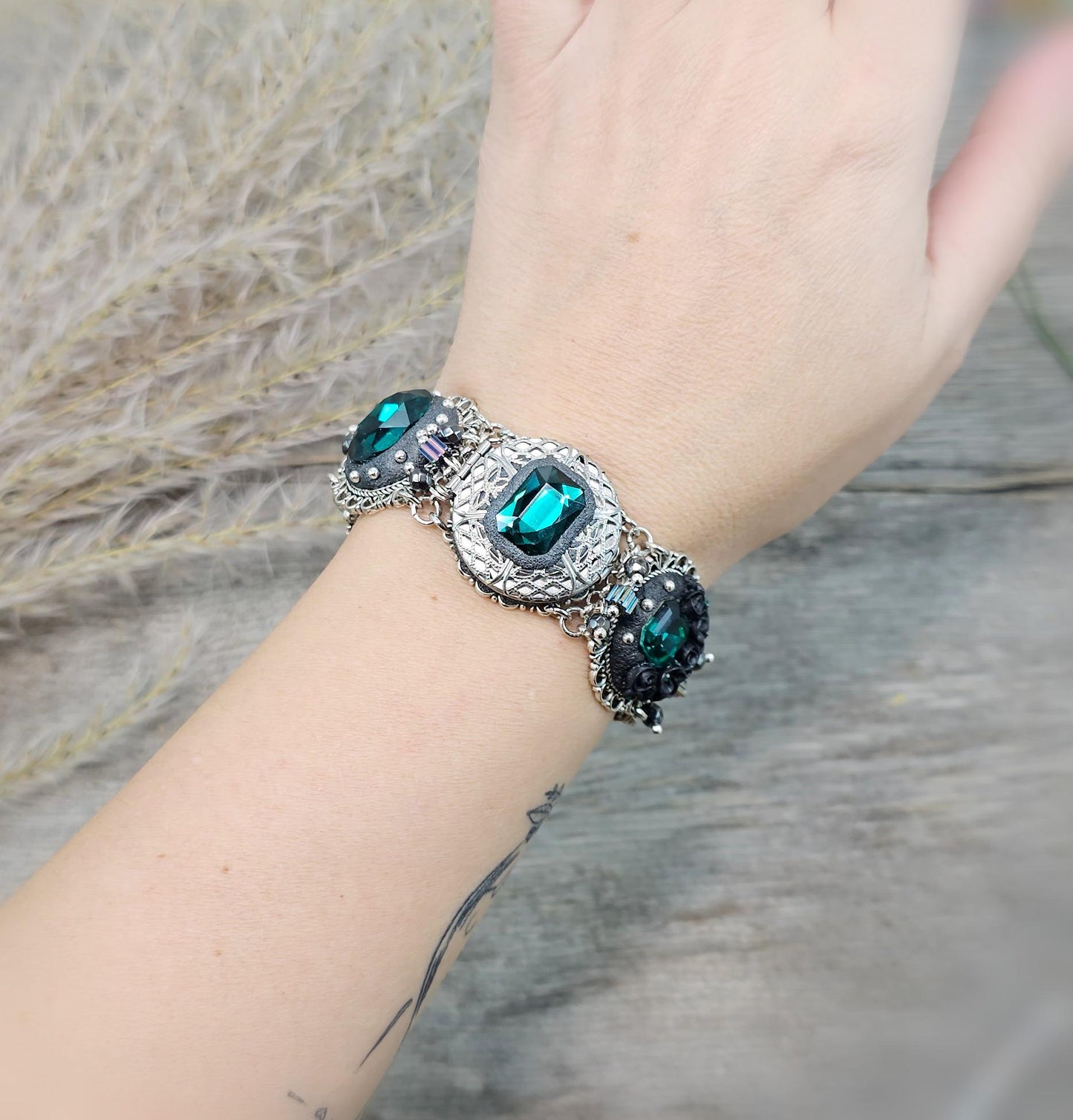 Emerald crystal bracelet with locket, black polymer clay flowers