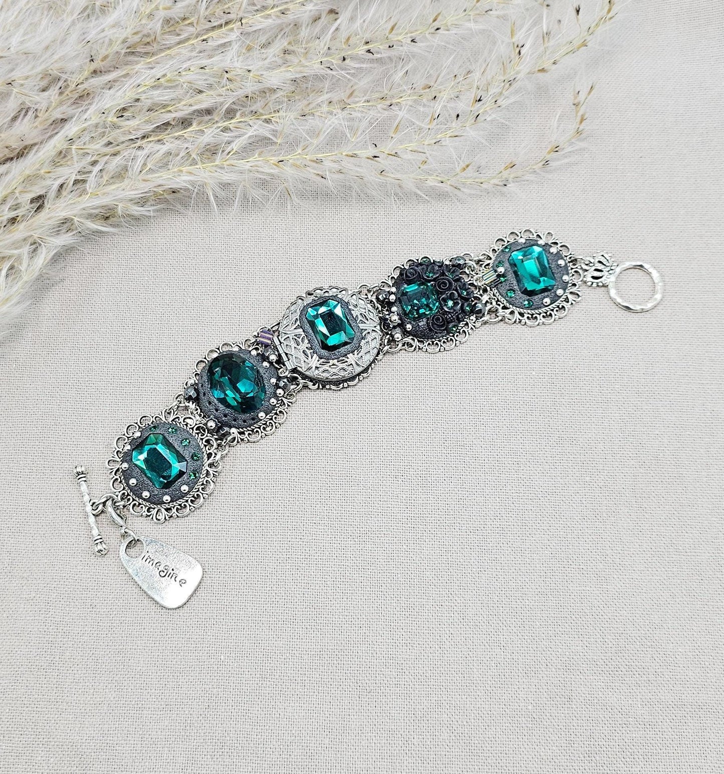 Emerald crystal bracelet with locket, black polymer clay flowers