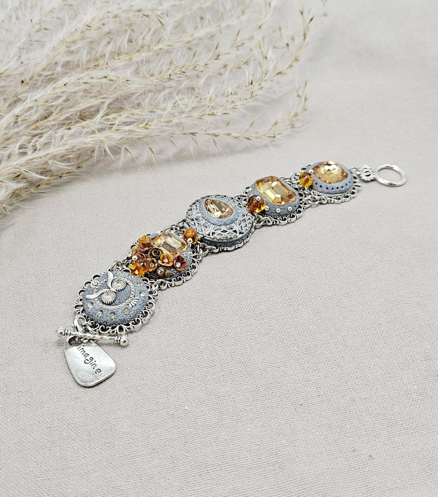 Gold color crystal bracelet with locket, owl detail, polymer clay flowers, floral bracelet. With amber beads. Amber Beads, Gold Beads, Tone Bracelet, Owl Bracelet, Polymer Flowers, Crystal Bracelet, Gold Crystal
