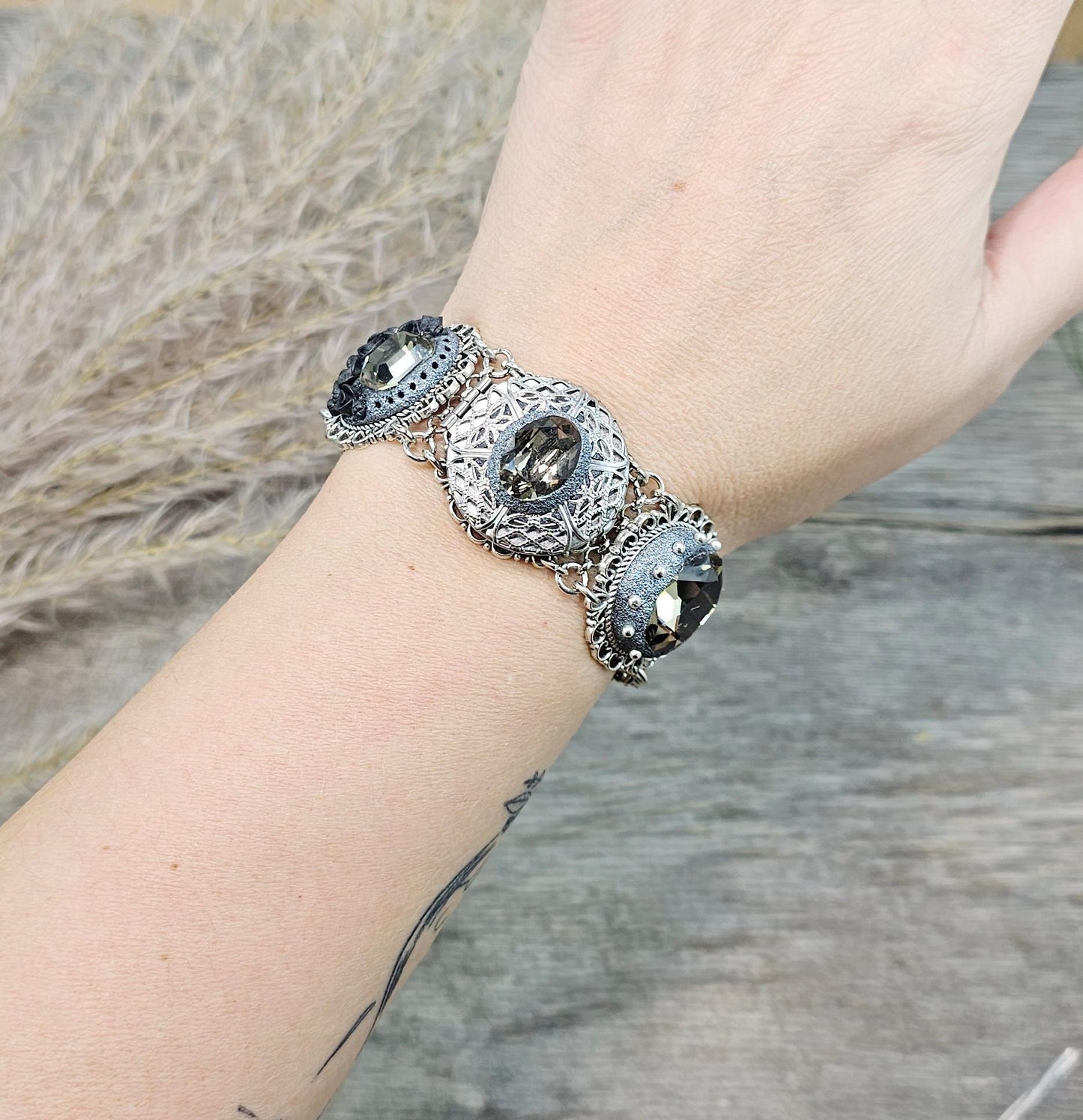 Dark crystal bracelet with locket, black polymer clay flowers, tree, dragonfly
