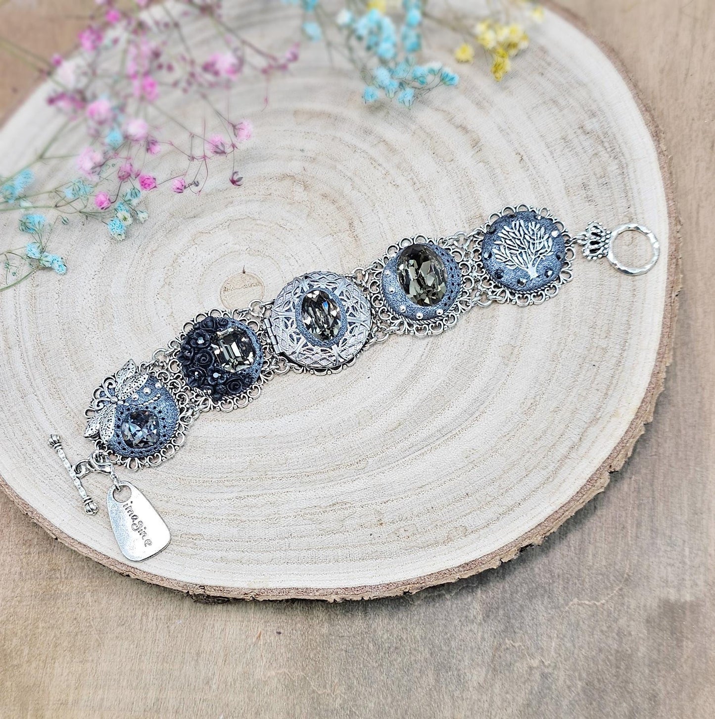 Dark crystal bracelet with locket, black polymer clay flowers, tree, dragonfly