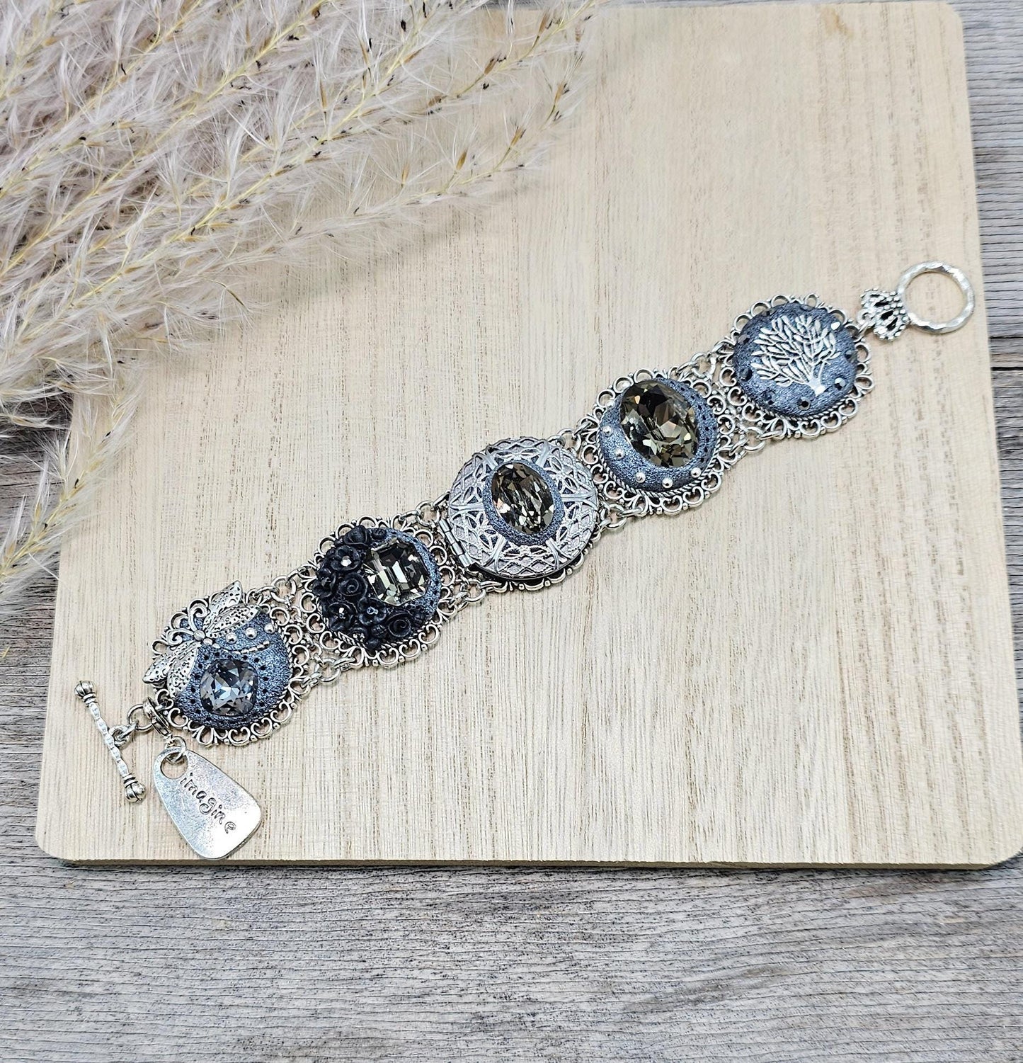 Dark crystal bracelet with locket, black polymer clay flowers, tree, dragonfly