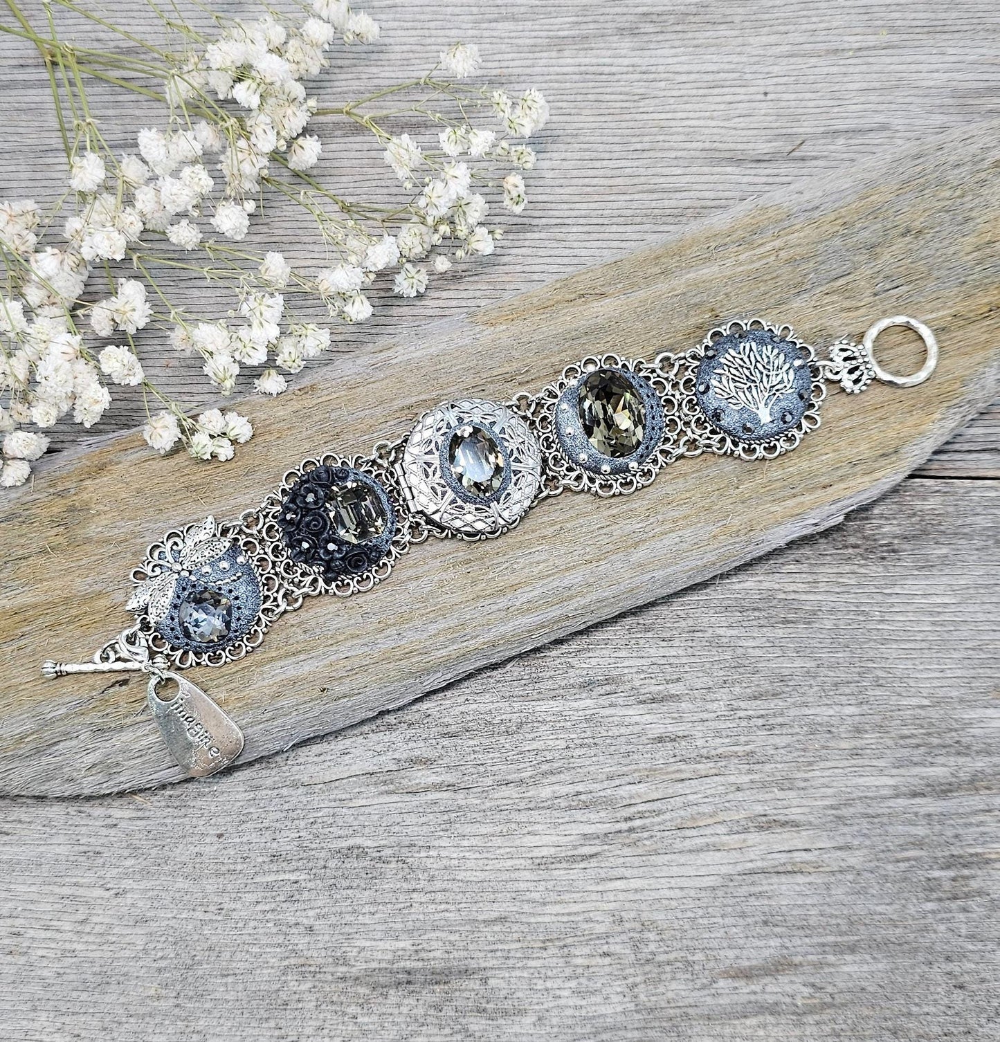 Dark crystal bracelet with locket, black polymer clay flowers, tree, dragonfly