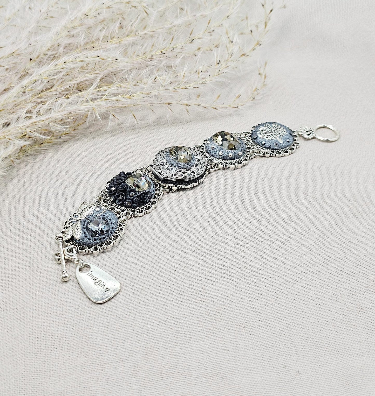 Dark crystal bracelet with locket, black polymer clay flowers, tree, dragonfly