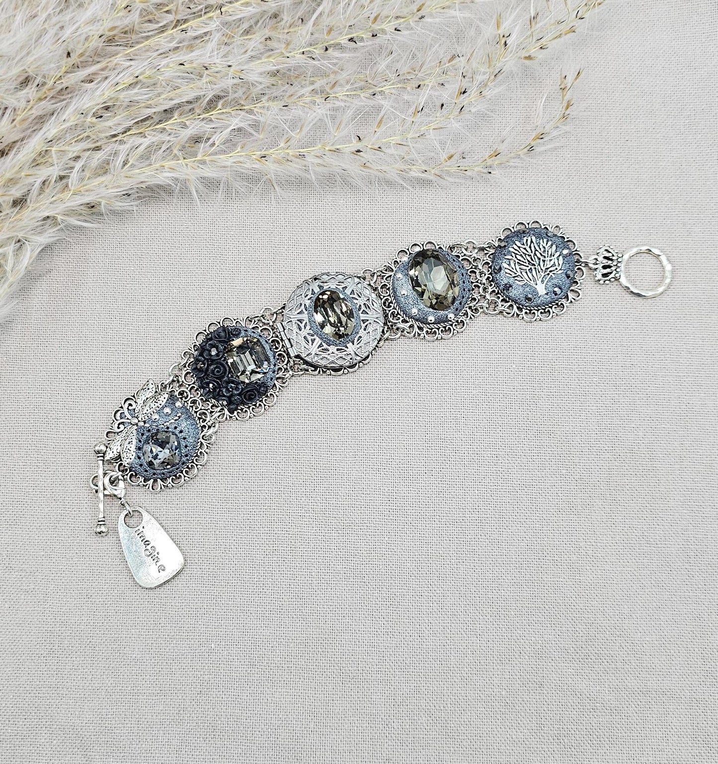Dark crystal bracelet with locket, black polymer clay flowers, tree, dragonfly