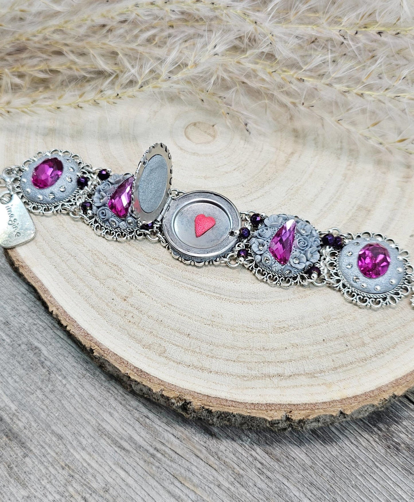 Pink crystal bracelet with locket ant silver tone polymer clay flowers