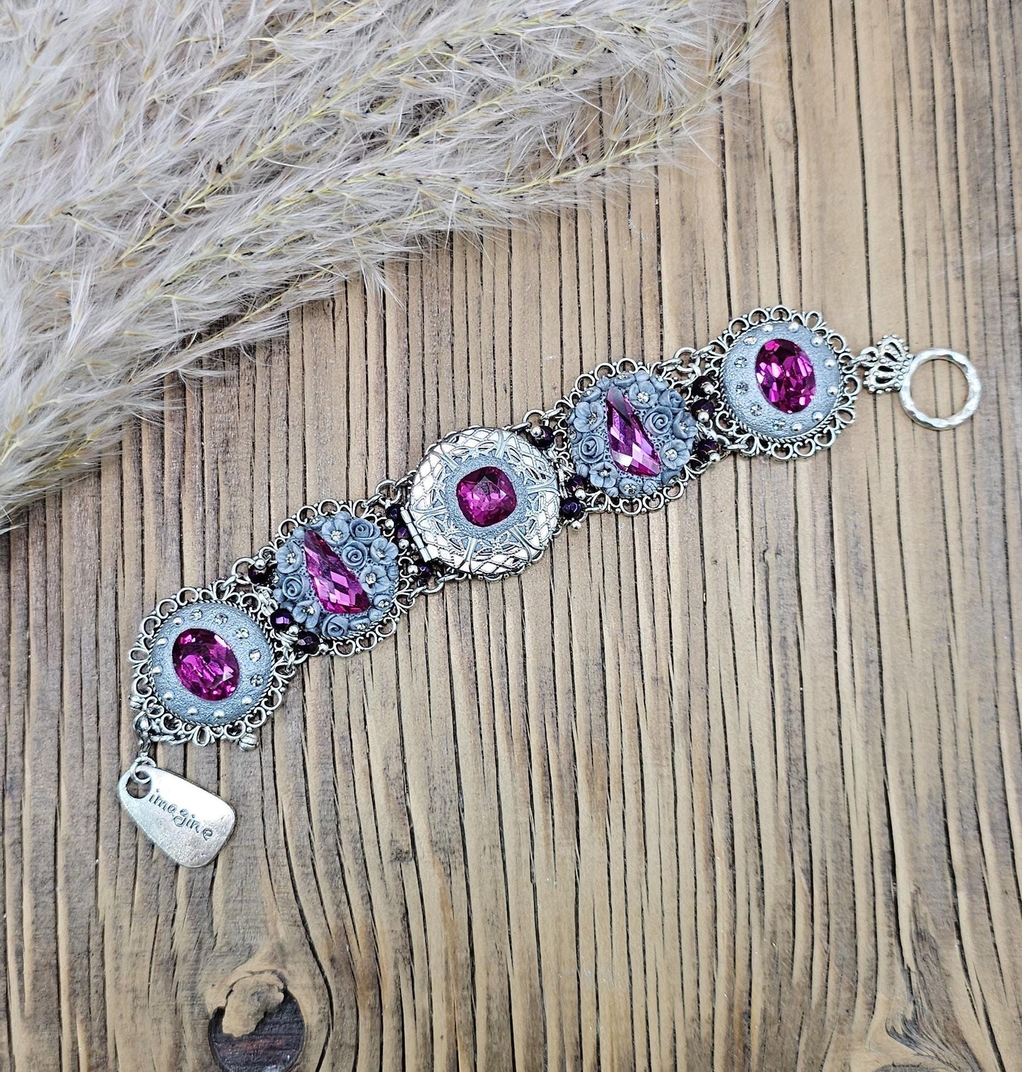 Pink crystal bracelet with locket ant silver tone polymer clay flowers