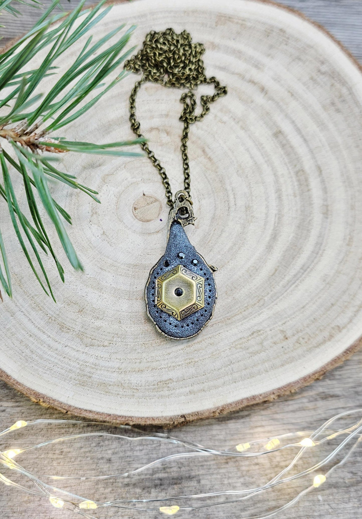 A magical pendant featuring a wizard’s hat, a stunning labradorite stone, and a hidden locket on the other side. Say “Abracadabra” and let your wishes come true!