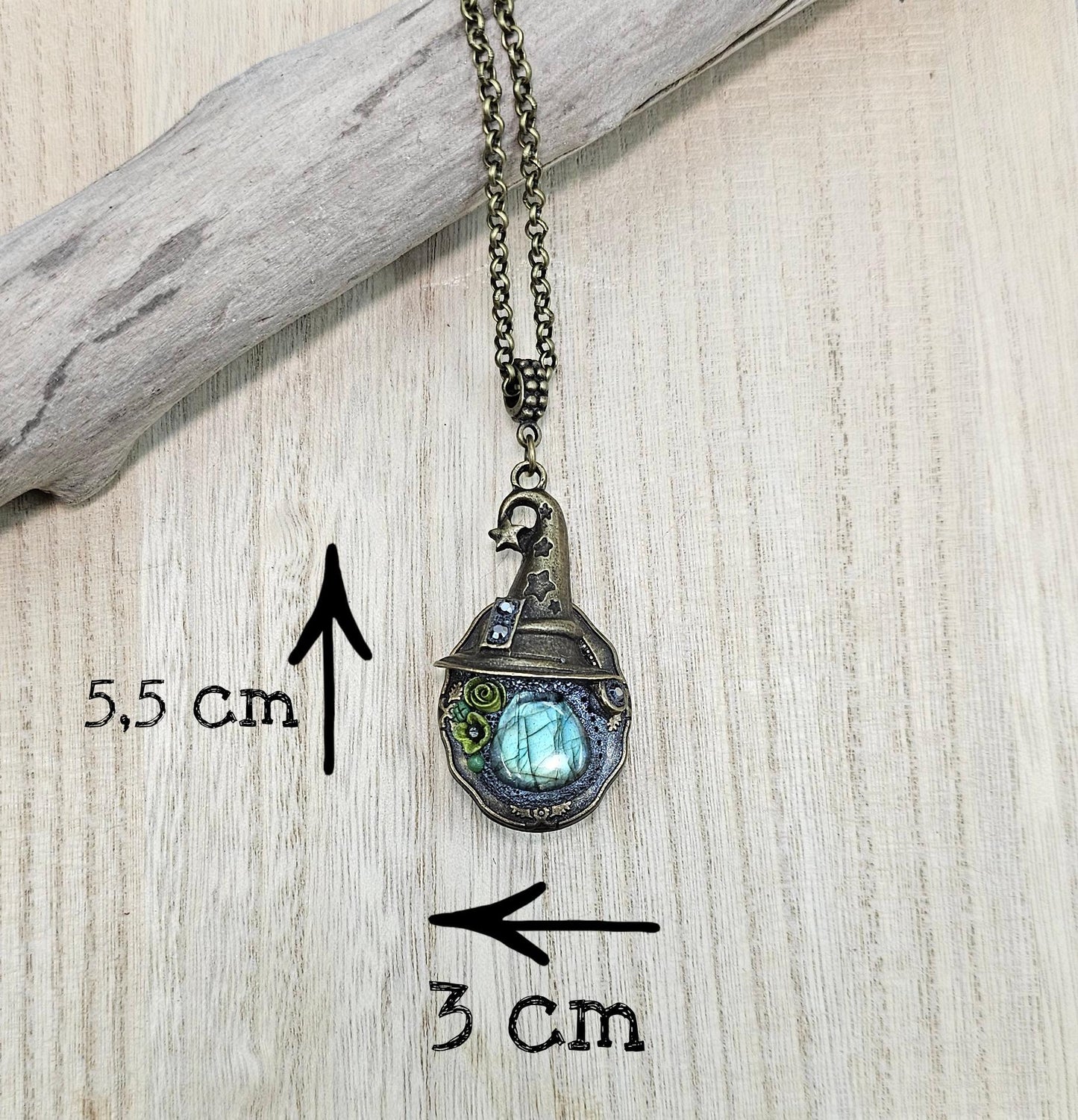 A magical pendant featuring a wizard’s hat, a stunning labradorite stone, and a hidden locket on the other side. Say “Abracadabra” and let your wishes come true!