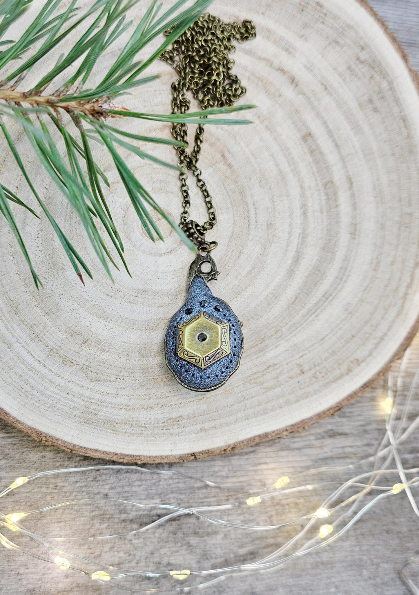 A magical pendant featuring a wizard’s hat, a stunning labradorite stone, and a hidden locket on the other side. Say “Abracadabra” and let your wishes come true!