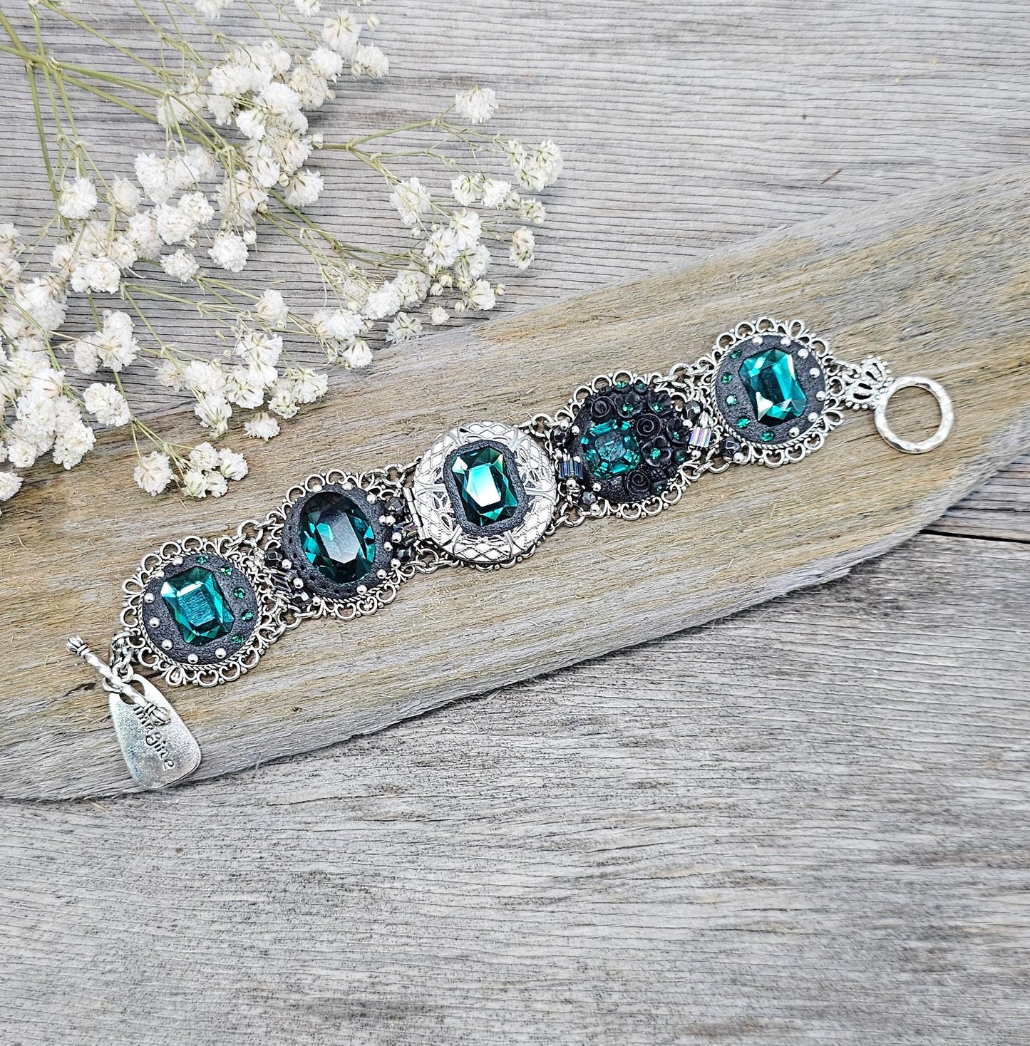 Emerald crystal bracelet with locket, black polymer clay flowers