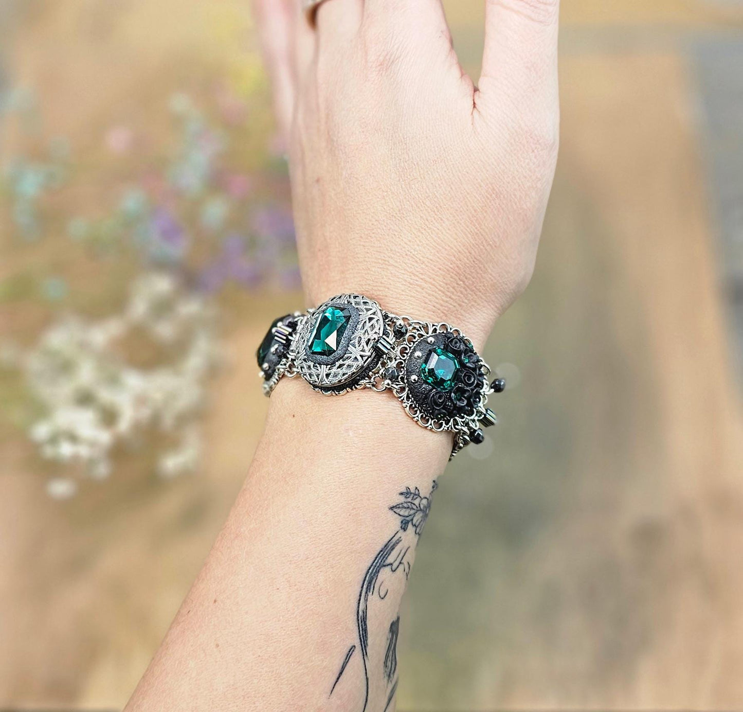 Emerald crystal bracelet with locket, black polymer clay flowers