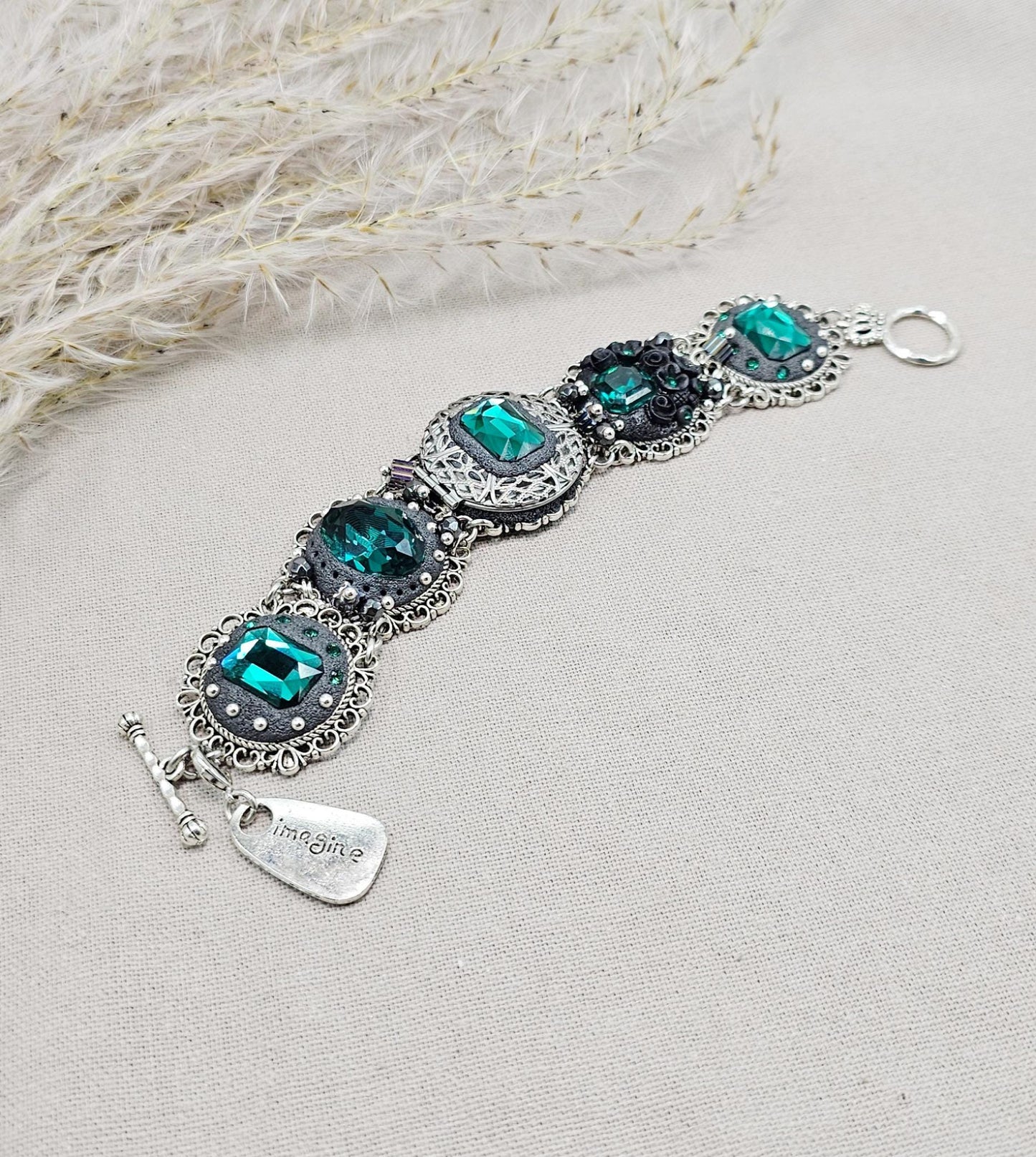 Emerald crystal bracelet with locket, black polymer clay flowers