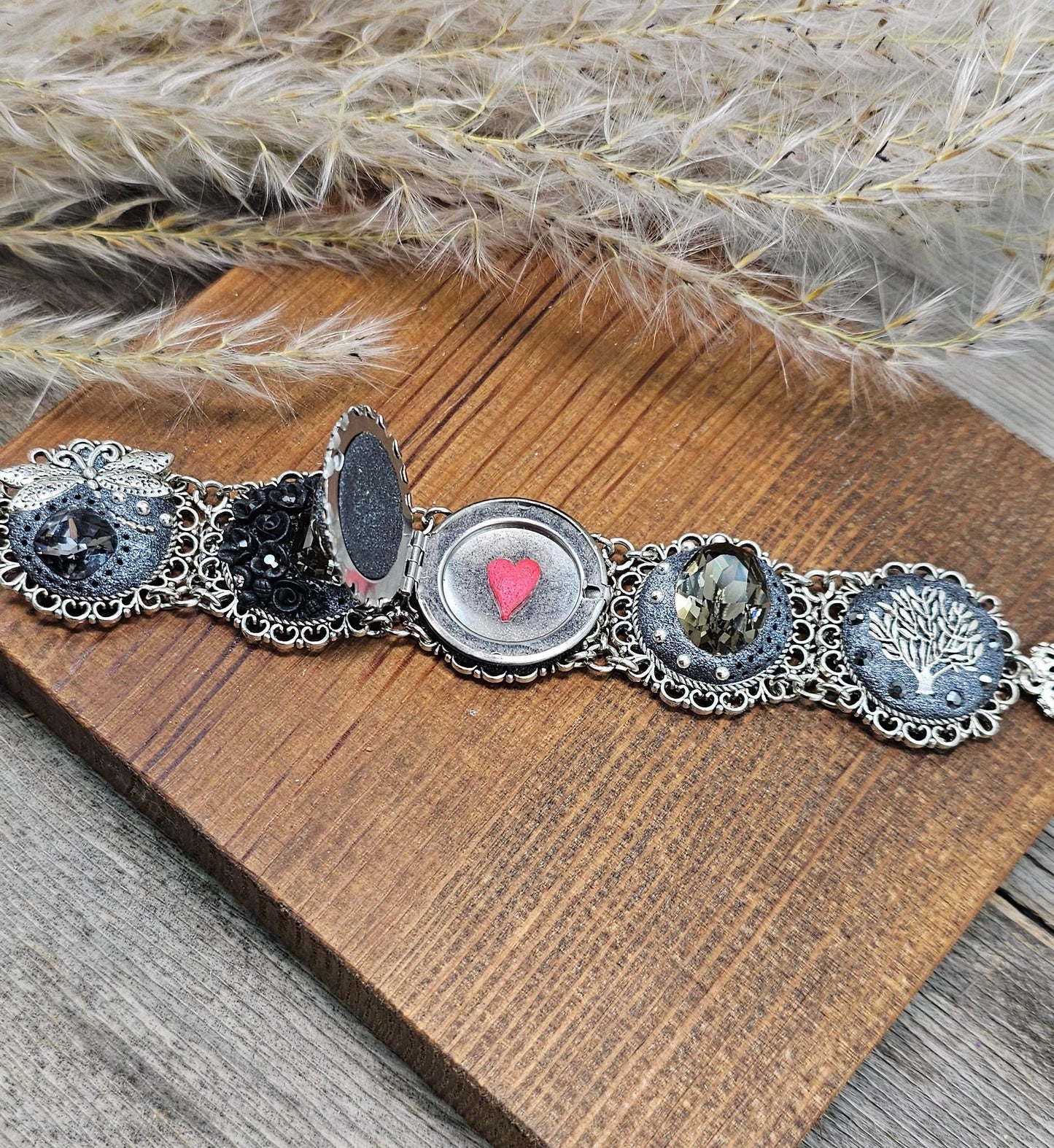Dark crystal bracelet with locket, black polymer clay flowers, tree, dragonfly