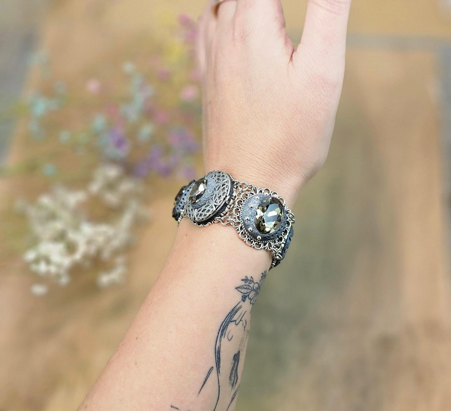 Dark crystal bracelet with locket, black polymer clay flowers, tree, dragonfly