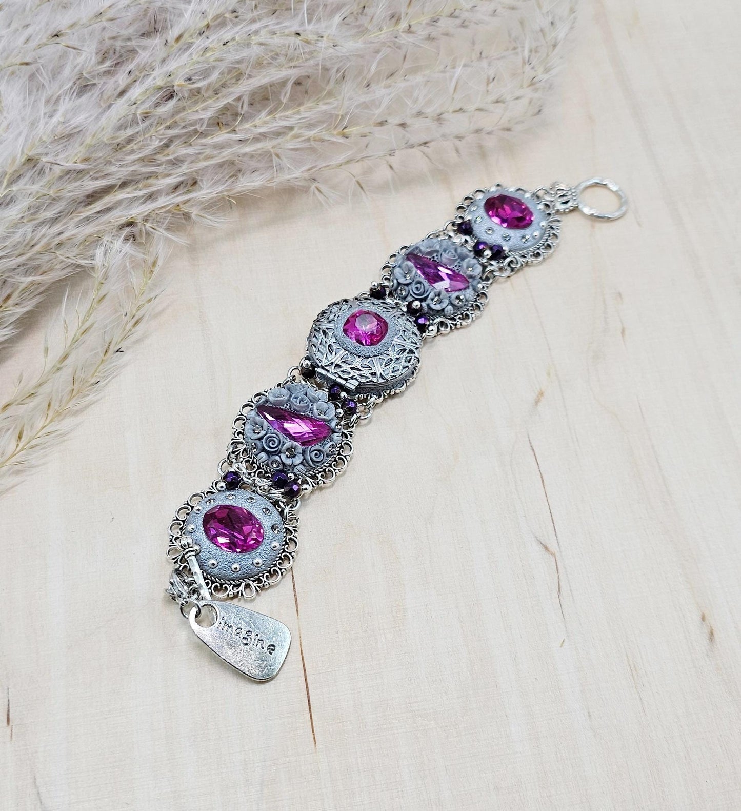 Pink crystal bracelet with locket ant silver tone polymer clay flowers