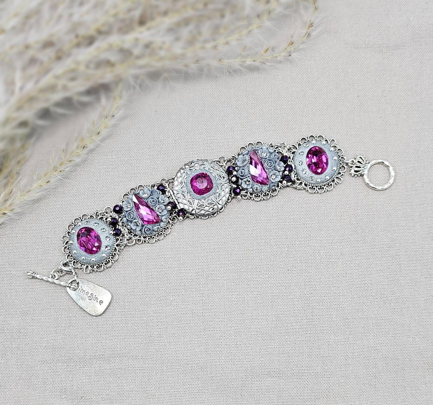 Pink crystal bracelet with locket ant silver tone polymer clay flowers