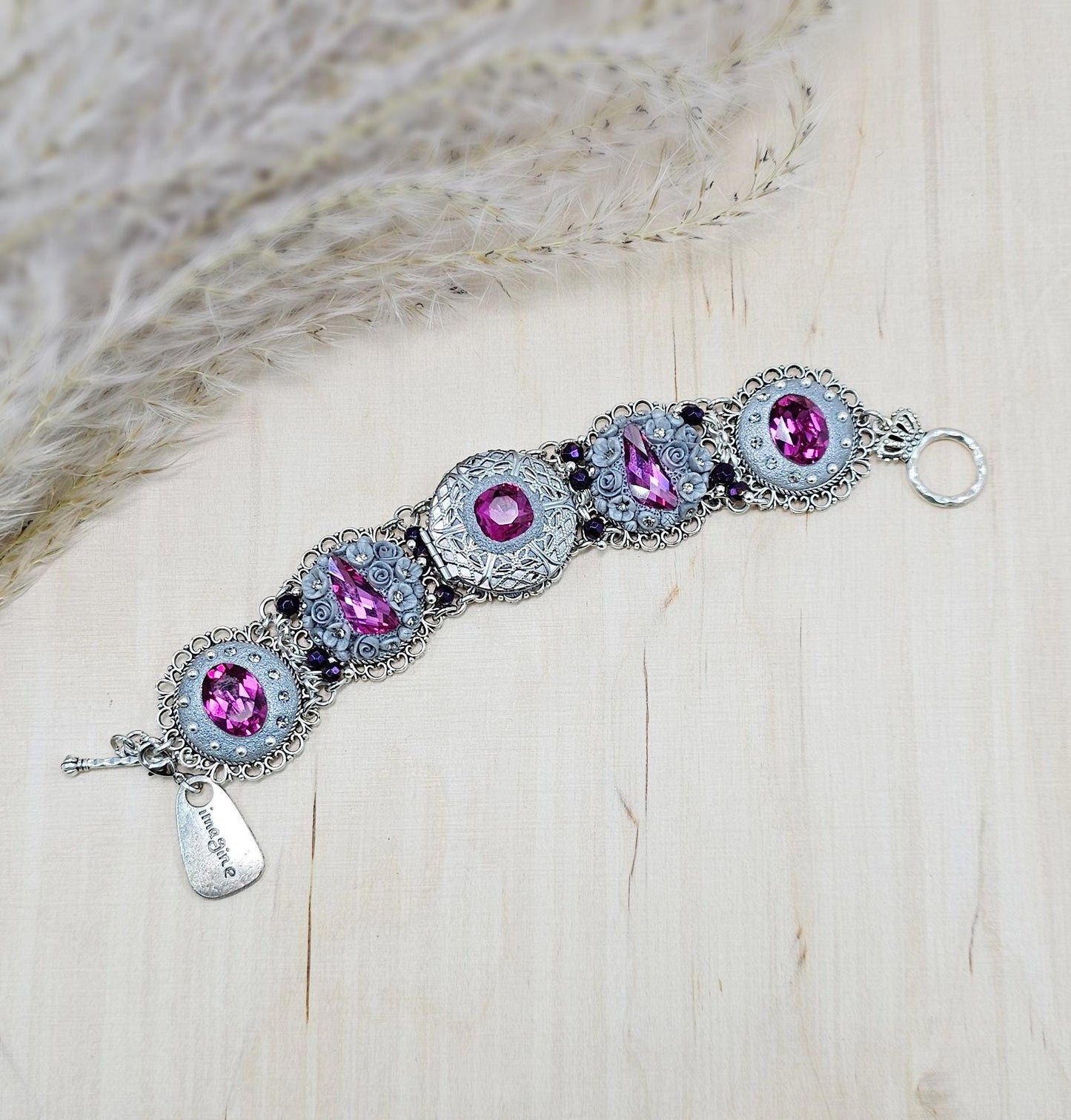 Pink crystal bracelet with locket ant silver tone polymer clay flowers