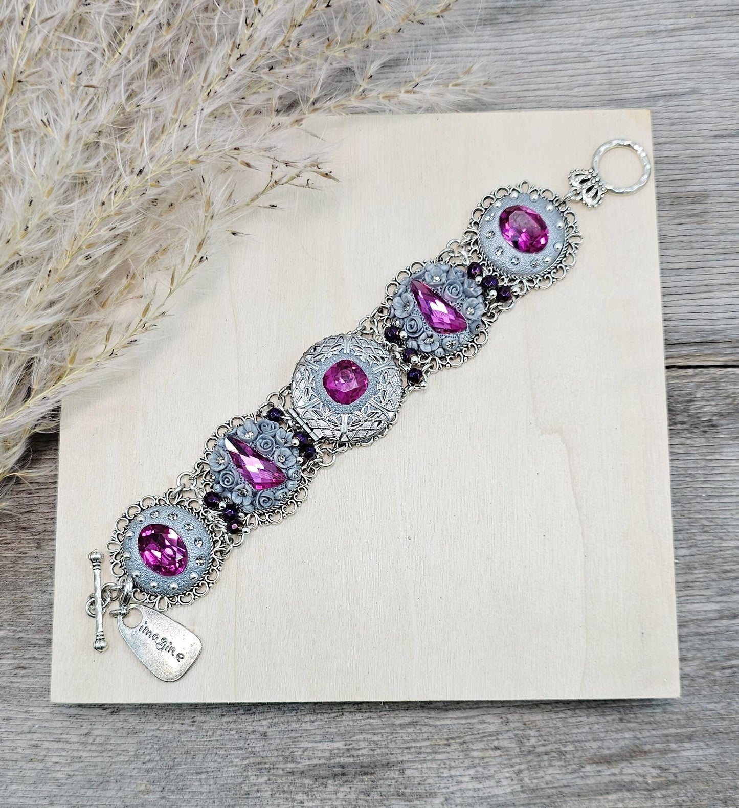 Pink crystal bracelet with locket ant silver tone polymer clay flowers