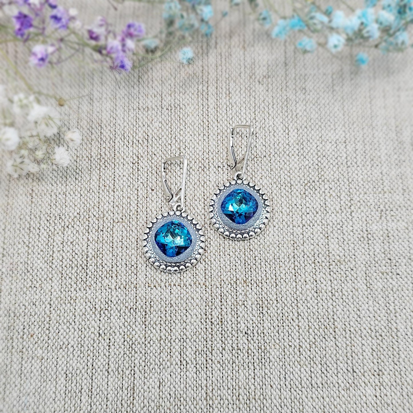 Elegant BLUE dangle earrings with sparkling blue crystals set in metal frames with polymer clay details. Silver hooks. Packaged in a paper gift box. A perfect accessory for any occasion, adding a touch of brilliance and sophistication