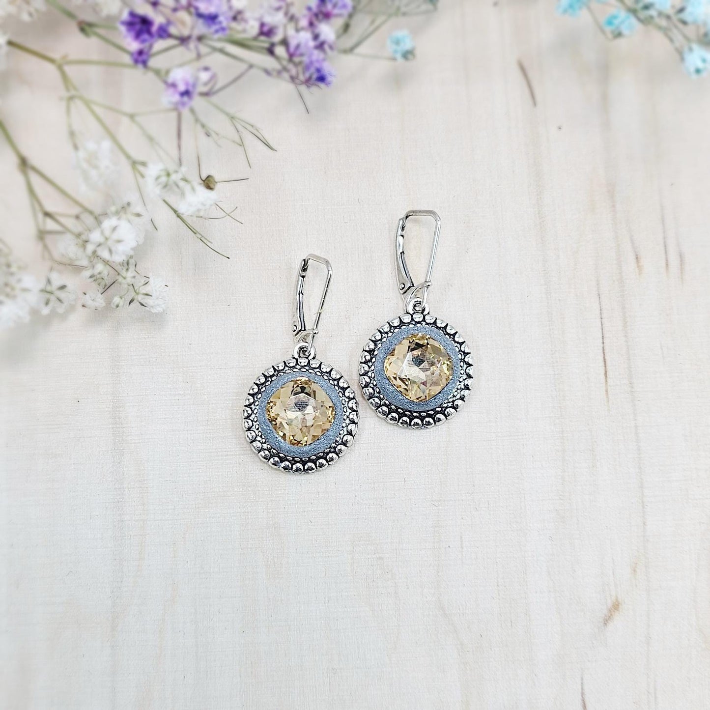 Elegant dangle earrings with sparkling gold color crystals set in metal frames with polymer clay details. Silver hooks. Packaged in a paper gift box. A perfect accessory for any occasion, adding a touch of brilliance and sophistication