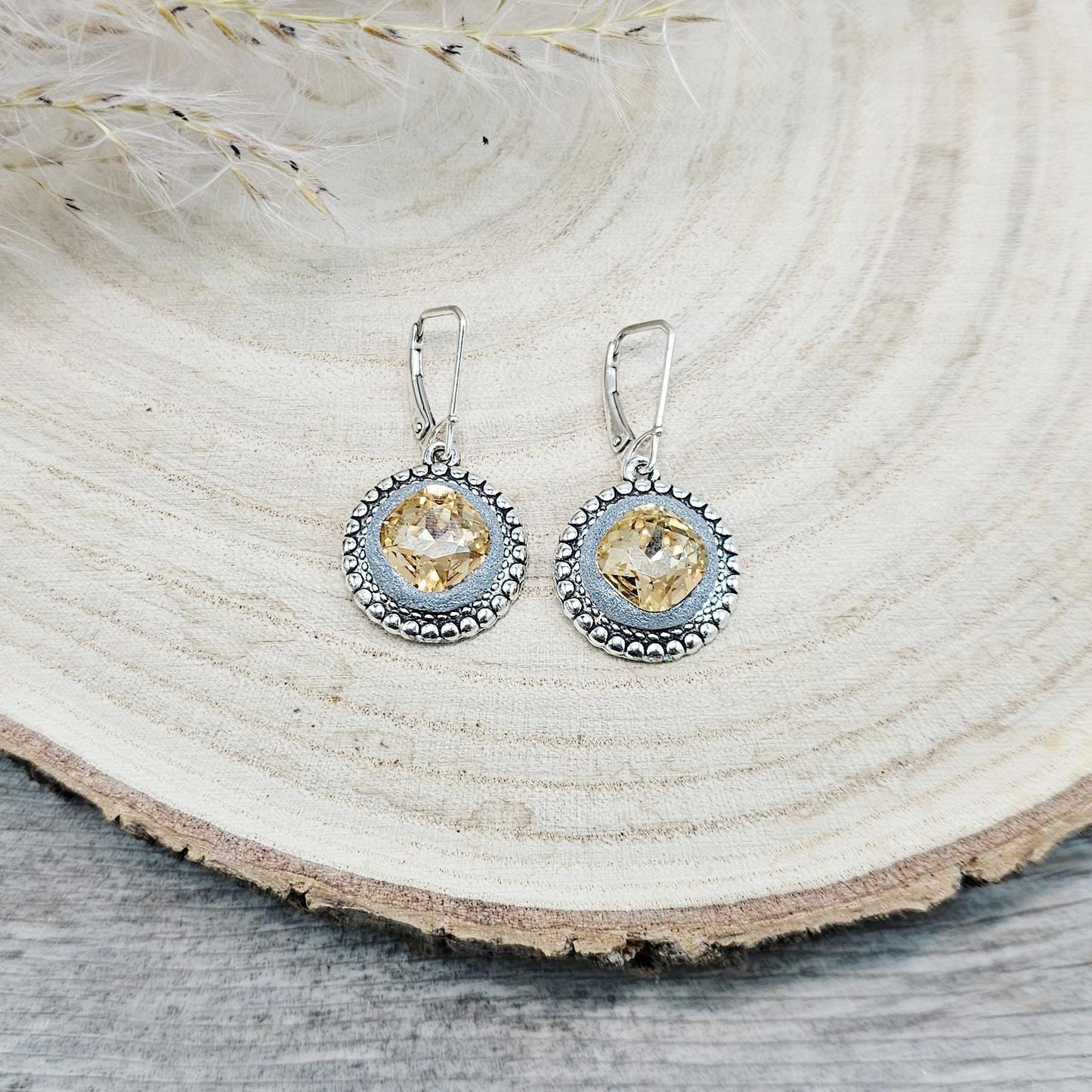 Elegant dangle earrings with sparkling gold color crystals set in metal frames with polymer clay details. Silver hooks. Packaged in a paper gift box. A perfect accessory for any occasion, adding a touch of brilliance and sophistication