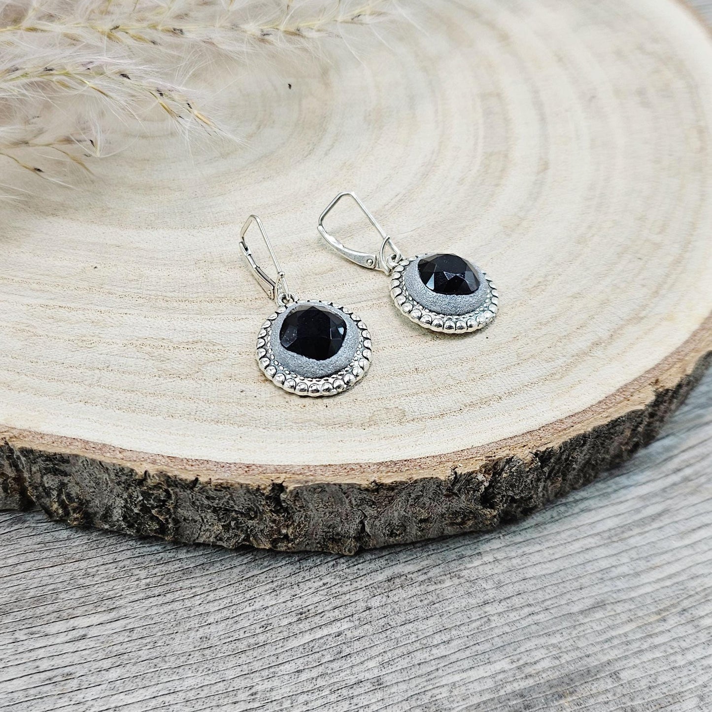 Elegant dangle earrings with sparkling black crystals set in metal frames with polymer clay details. Silver hooks. Packaged in a paper gift box. A perfect accessory for any occasion, adding a touch of brilliance and sophistication