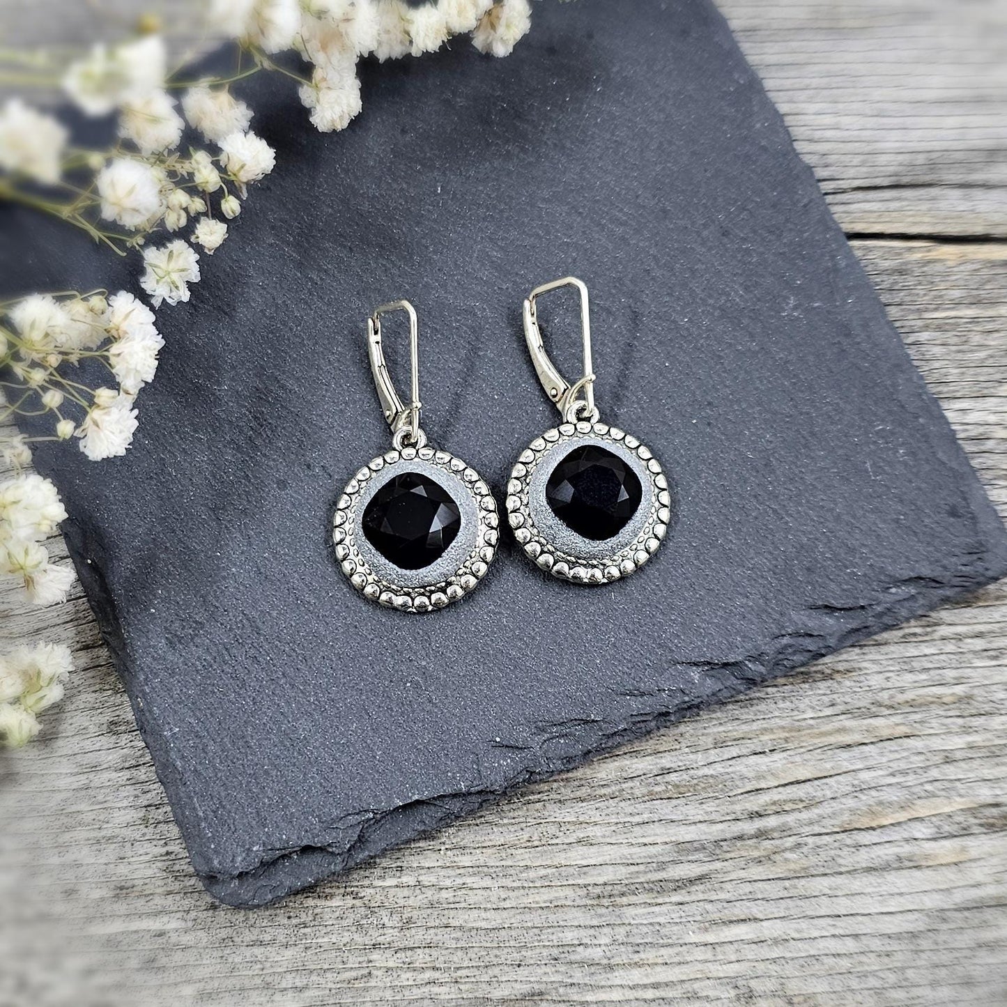 Elegant dangle earrings with sparkling black crystals set in metal frames with polymer clay details. Silver hooks. Packaged in a paper gift box. A perfect accessory for any occasion, adding a touch of brilliance and sophistication