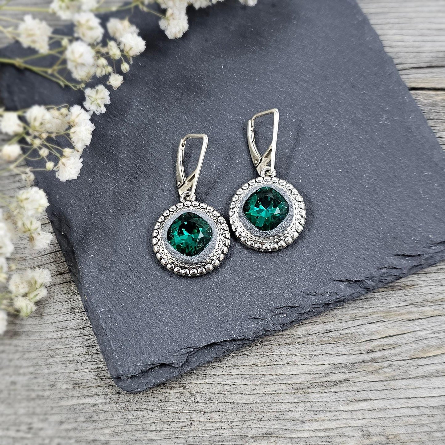 Elegant dangle earrings with sparkling emerald color crystals set in metal frames with polymer clay details. Silver hooks. Packaged in a paper gift box. A perfect accessory for any occasion, adding a touch of brilliance and sophistication