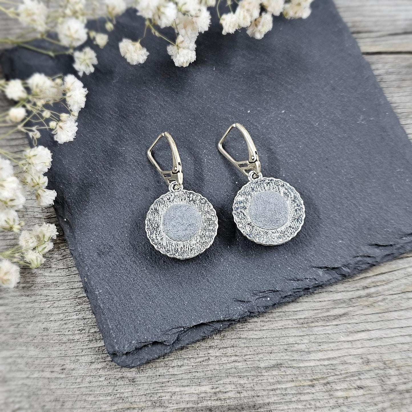 Elegant dangle earrings with sparkling Iridescent Green crystals set in metal frames with polymer clay details. Silver hooks. Packaged in a paper gift box. A perfect accessory for any occasion, adding a touch of brilliance and sophistication