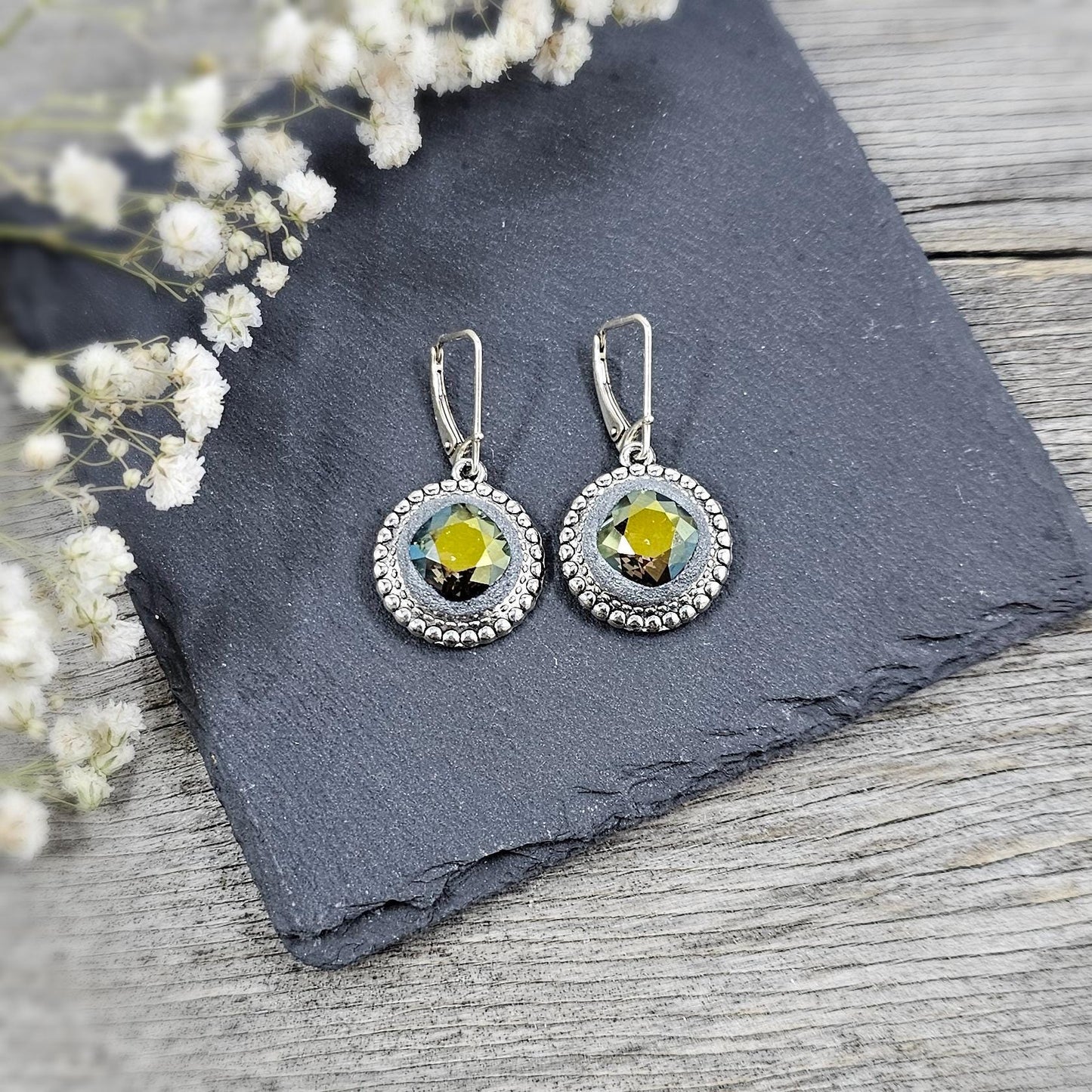 Elegant dangle earrings with sparkling Iridescent Green crystals set in metal frames with polymer clay details. Silver hooks. Packaged in a paper gift box. A perfect accessory for any occasion, adding a touch of brilliance and sophistication