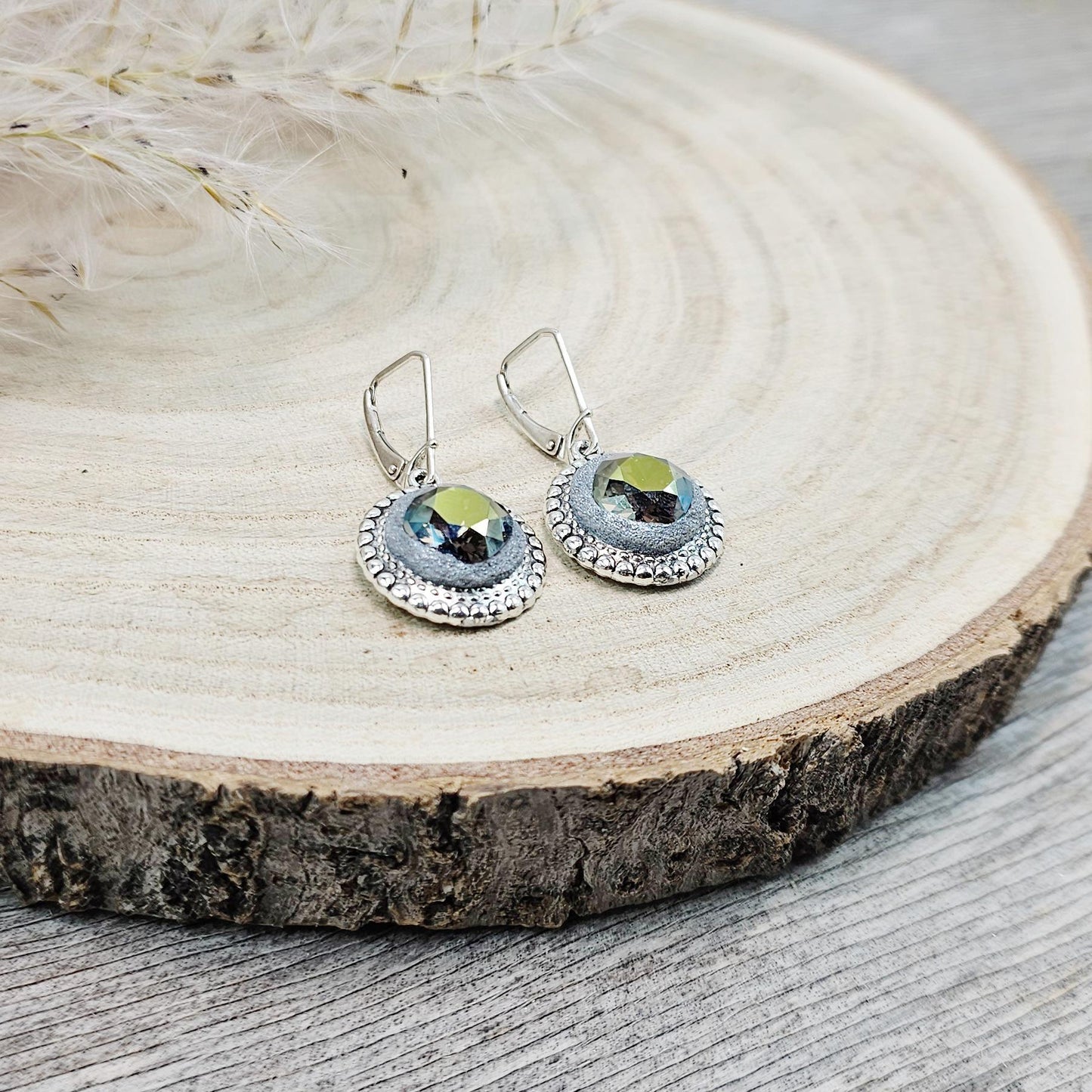 Elegant dangle earrings with sparkling Iridescent Green crystals set in metal frames with polymer clay details. Silver hooks. Packaged in a paper gift box. A perfect accessory for any occasion, adding a touch of brilliance and sophistication