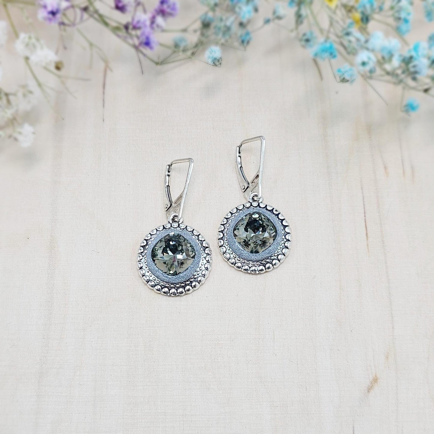 Elegant dangle earrings with sparkling Black Diamond crystals set in metal frames with polymer clay details. Silver hooks. Packaged in a paper gift box. A perfect accessory for any occasion, adding a touch of brilliance and sophistication