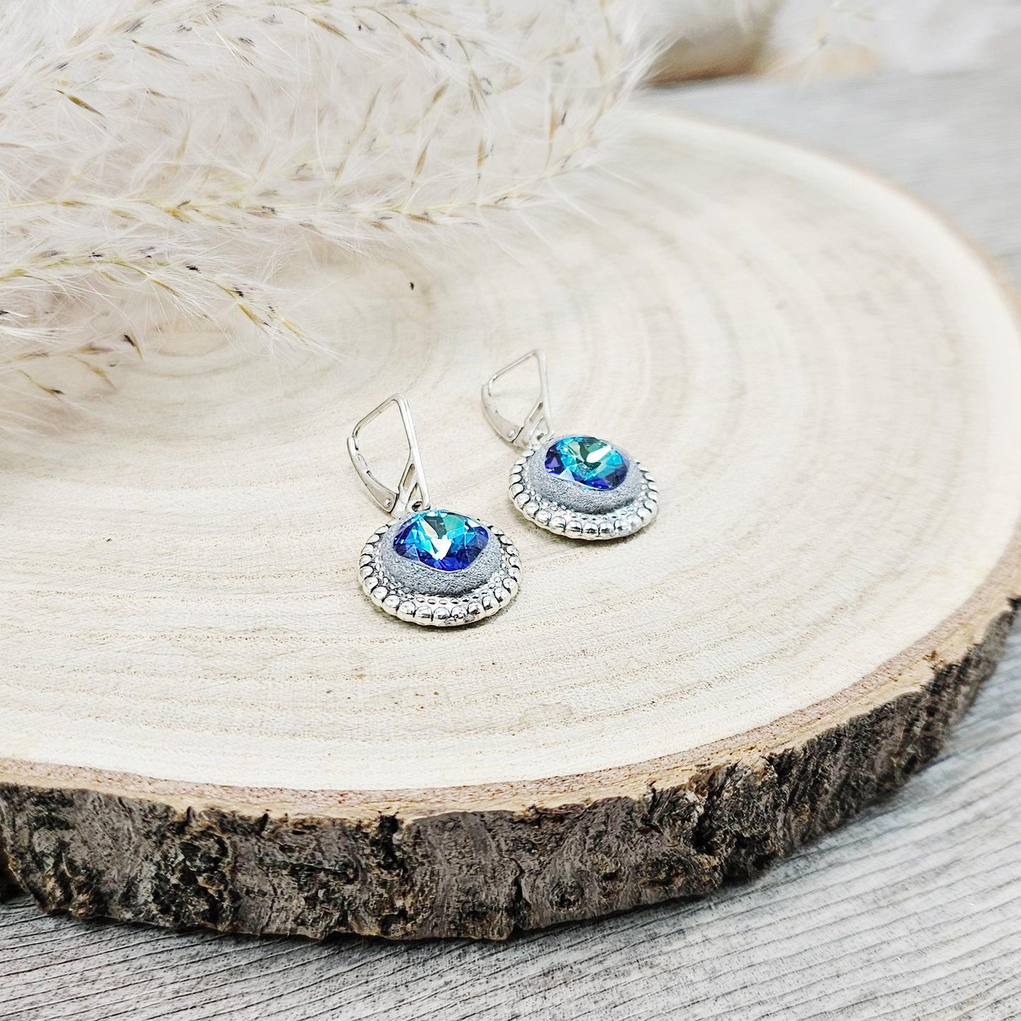 Elegant BLUE dangle earrings with sparkling blue crystals set in metal frames with polymer clay details. Silver hooks. Packaged in a paper gift box. A perfect accessory for any occasion, adding a touch of brilliance and sophistication