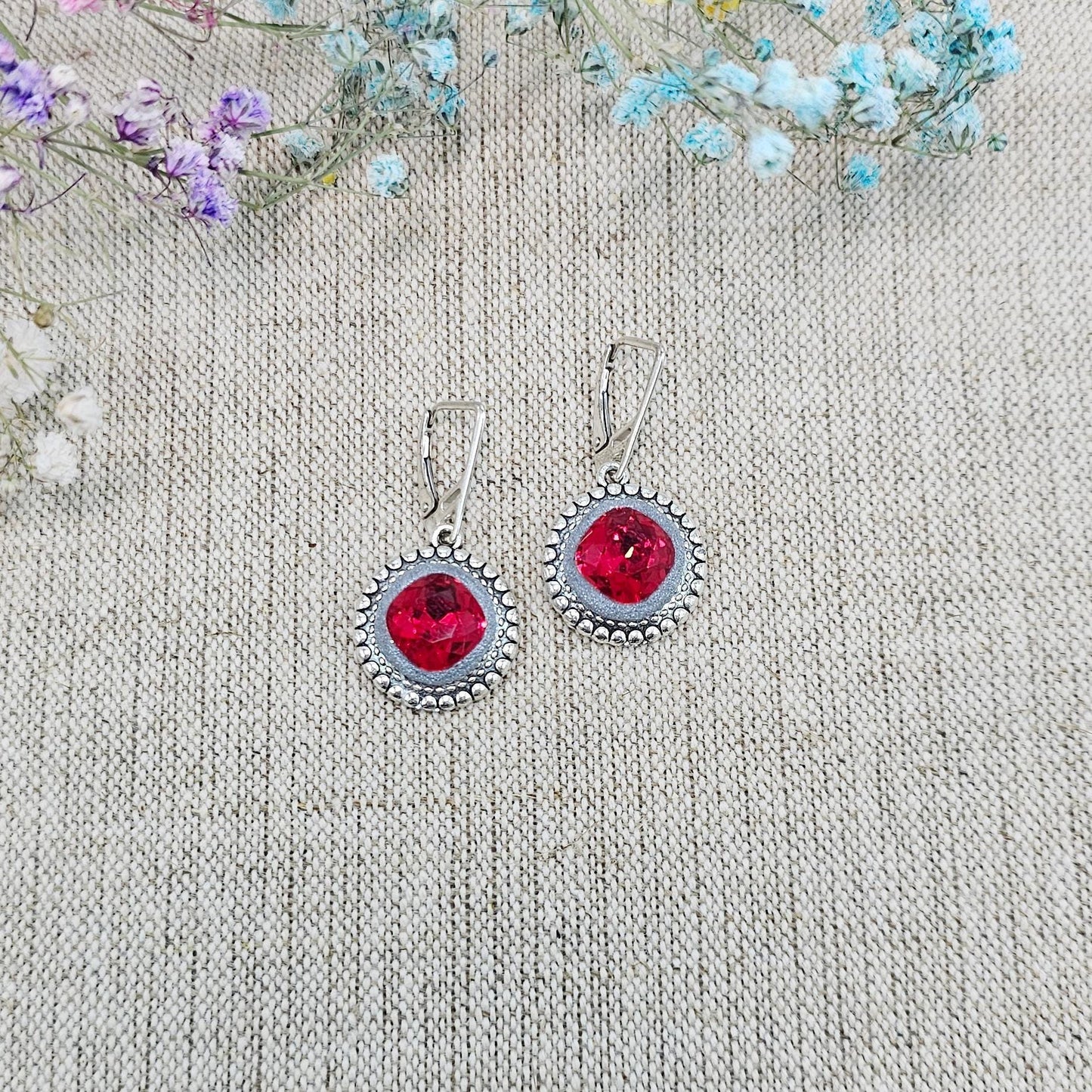 Elegant RED dangle earrings with sparkling crystals set in metal frames with polymer clay details. Silver hooks. Packaged in a paper gift box. A perfect accessory for any occasion, adding a touch of brilliance and sophistication