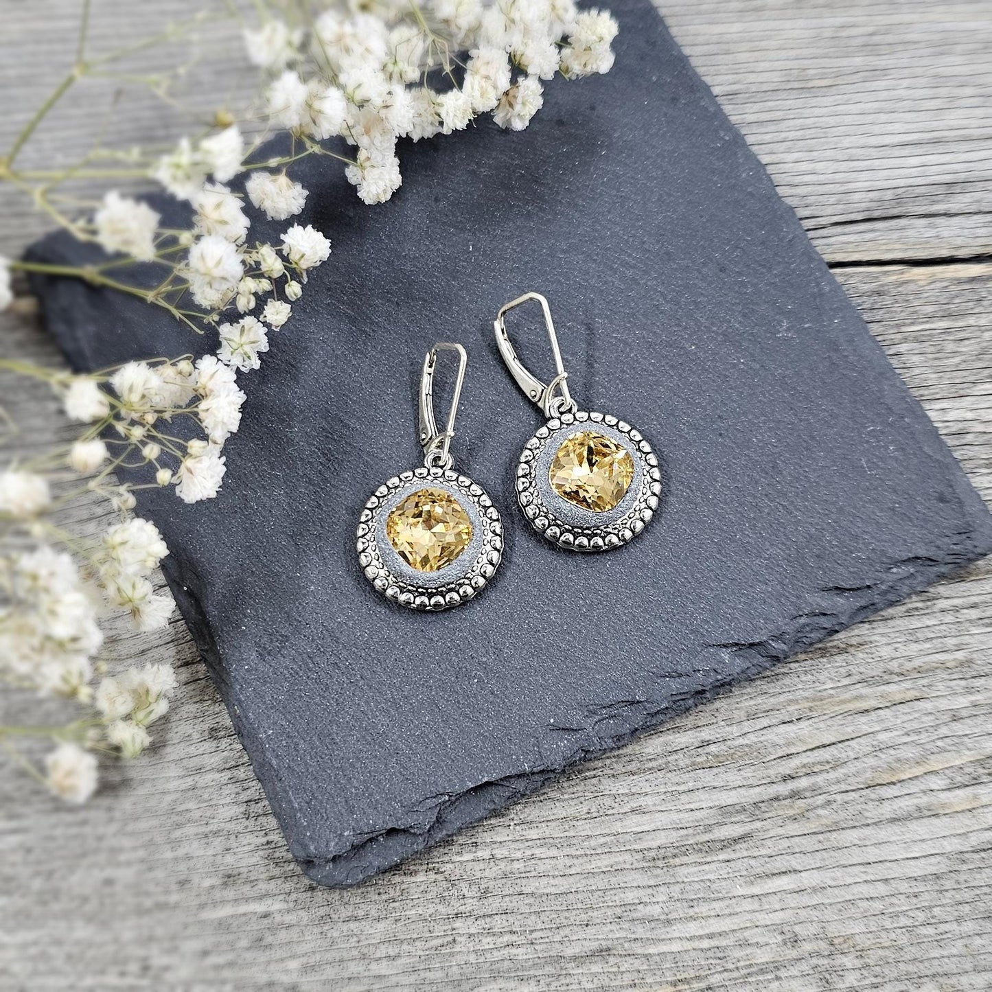 Elegant dangle earrings with sparkling gold color crystals set in metal frames with polymer clay details. Silver hooks. Packaged in a paper gift box. A perfect accessory for any occasion, adding a touch of brilliance and sophistication
