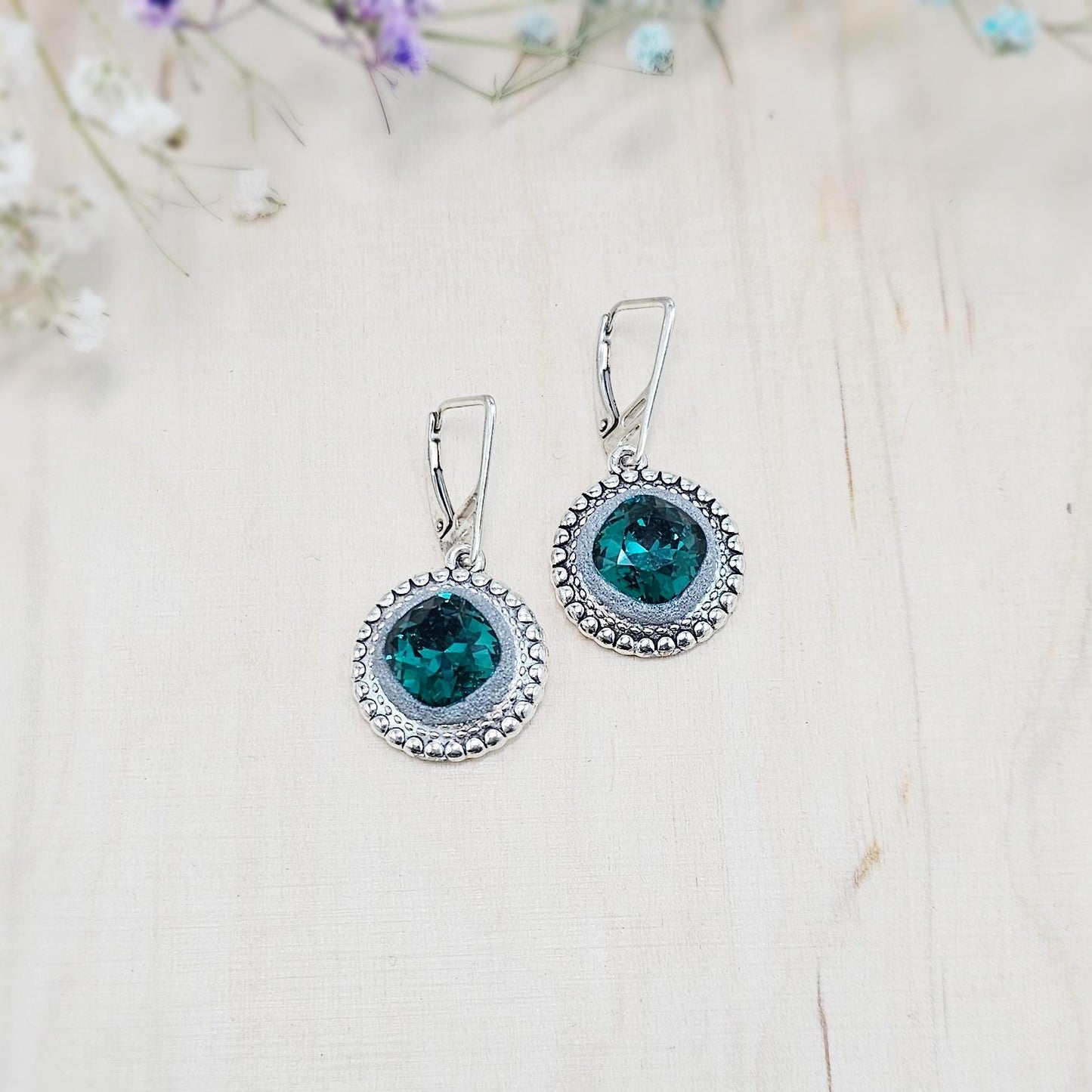 Elegant dangle earrings with sparkling emerald color crystals set in metal frames with polymer clay details. Silver hooks. Packaged in a paper gift box. A perfect accessory for any occasion, adding a touch of brilliance and sophistication