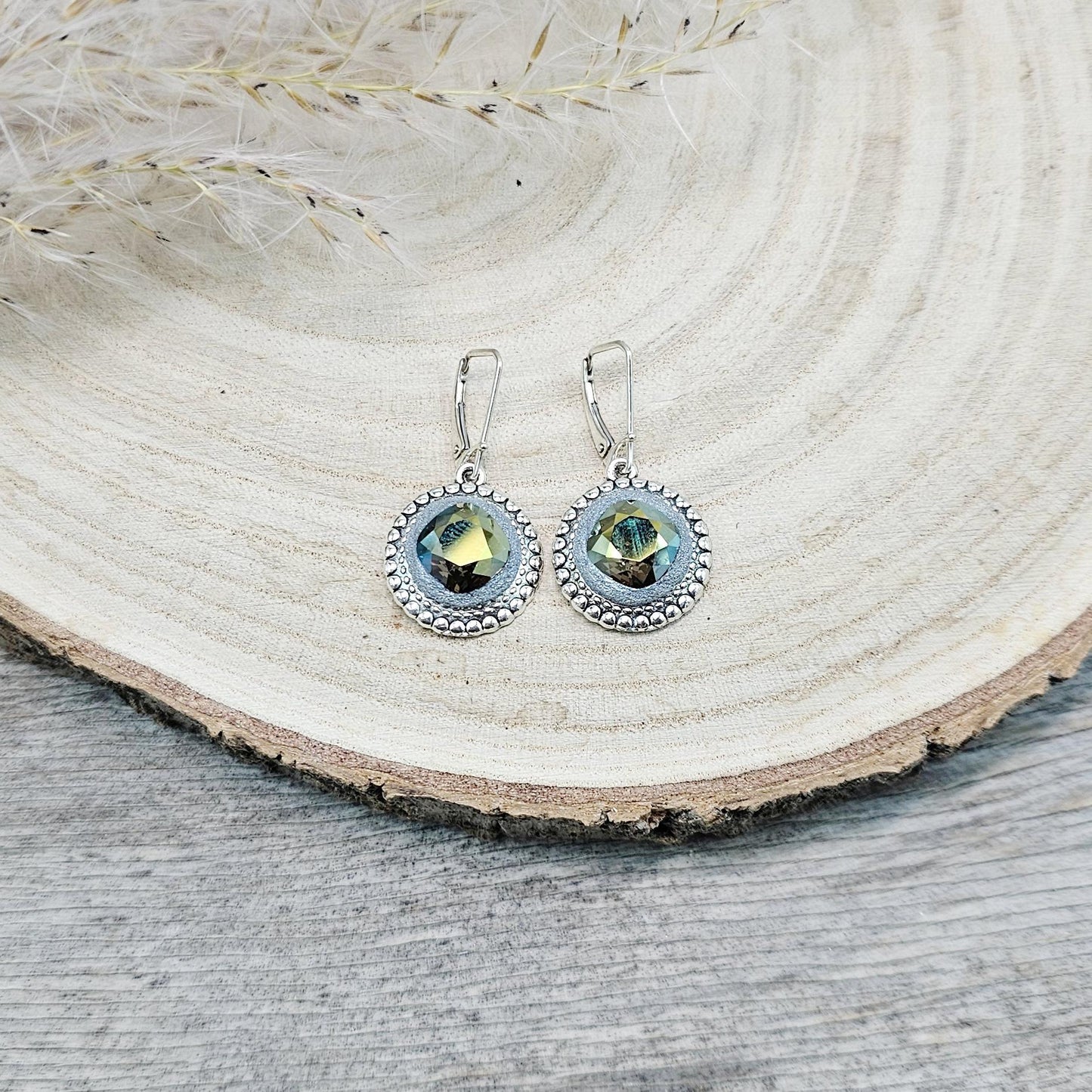 Elegant dangle earrings with sparkling Iridescent Green crystals set in metal frames with polymer clay details. Silver hooks. Packaged in a paper gift box. A perfect accessory for any occasion, adding a touch of brilliance and sophistication