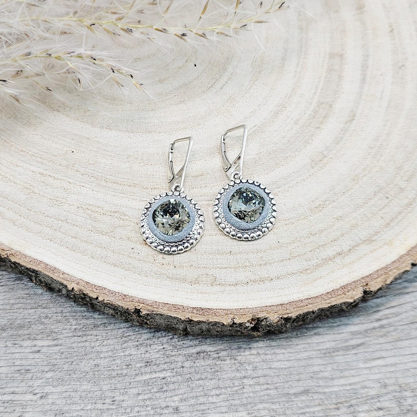 Elegant dangle earrings with sparkling Black Diamond crystals set in metal frames with polymer clay details. Silver hooks. Packaged in a paper gift box. A perfect accessory for any occasion, adding a touch of brilliance and sophistication