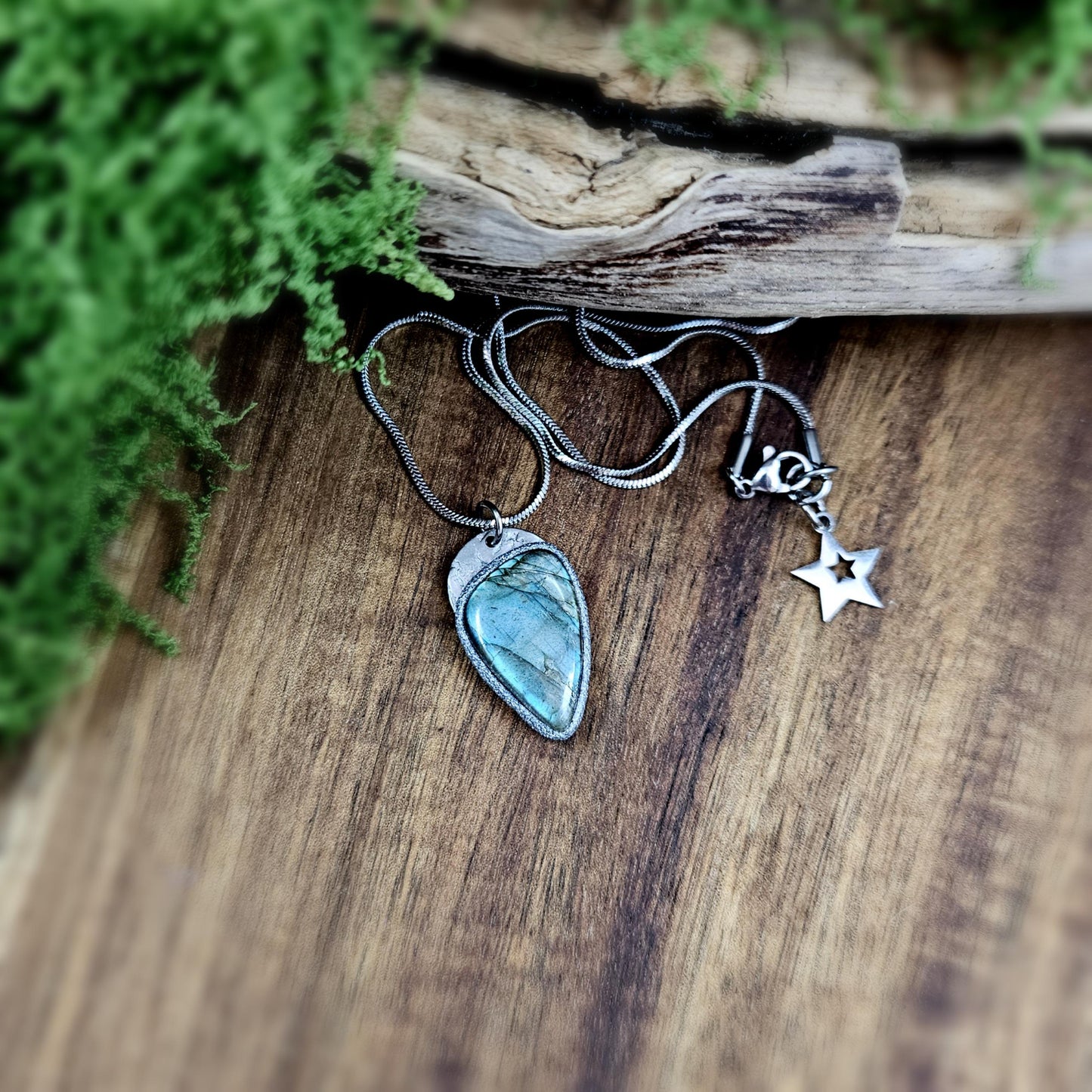 Natural labradorite necklace photographed on wood and moss. Earthy vibes with magical shimmer.