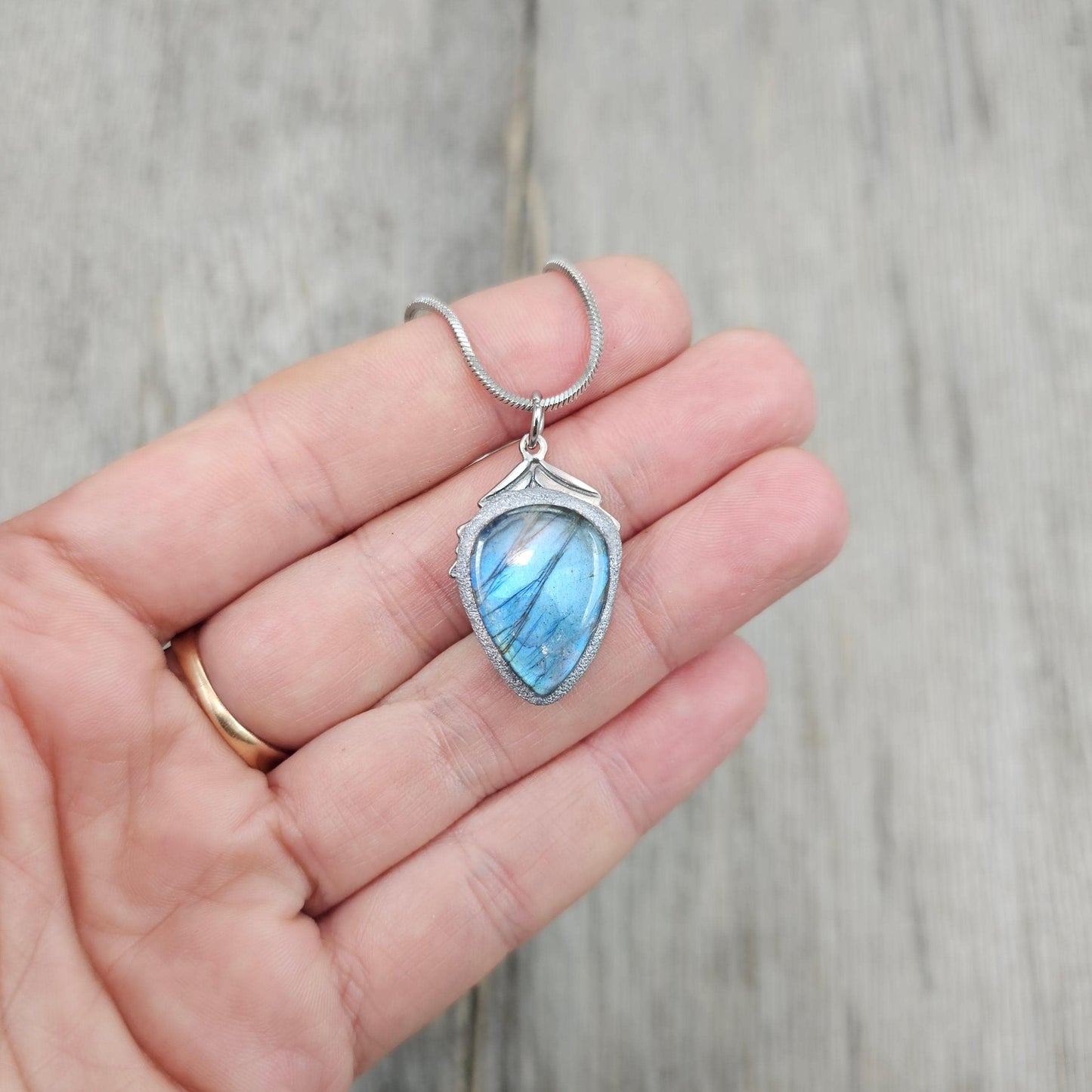 Handmade labradorite pendant necklace with a short stainless steel chain. Features a unique polymer clay setting. One of a kind magical jewelry, perfect gift for her.