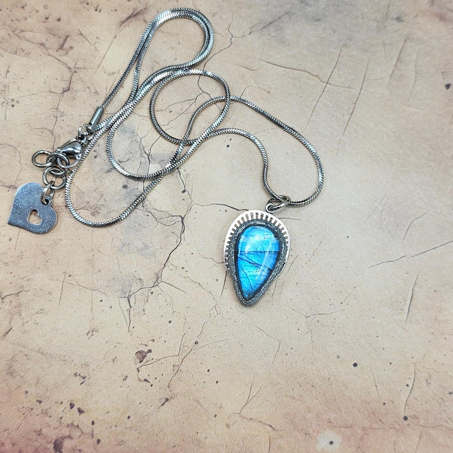 Handmade labradorite pendant necklace with a short stainless steel chain. Features a unique polymer clay setting. One of a kind magical jewelry, perfect gift for her.