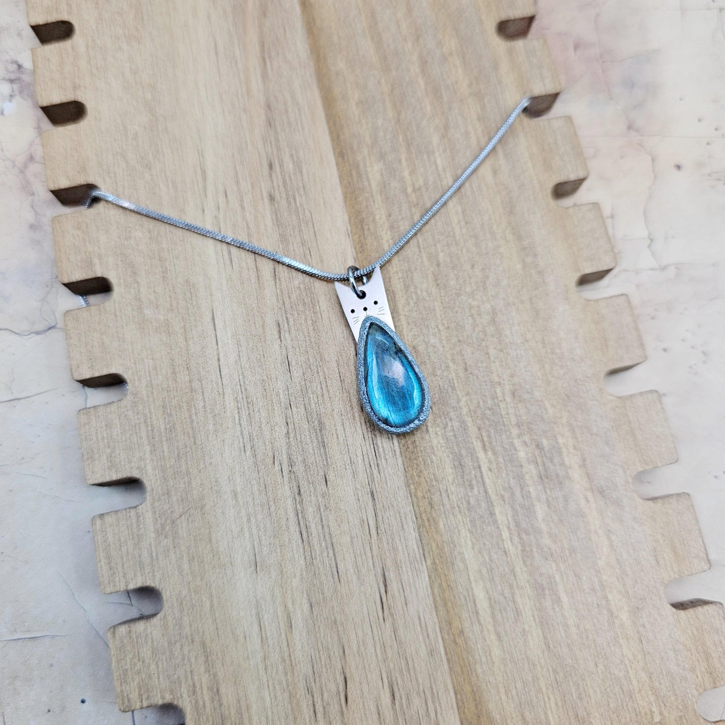 Handmade labradorite pendant necklace with a short stainless steel chain. Features a unique polymer clay setting. One of a kind magical jewelry, perfect gift for her.