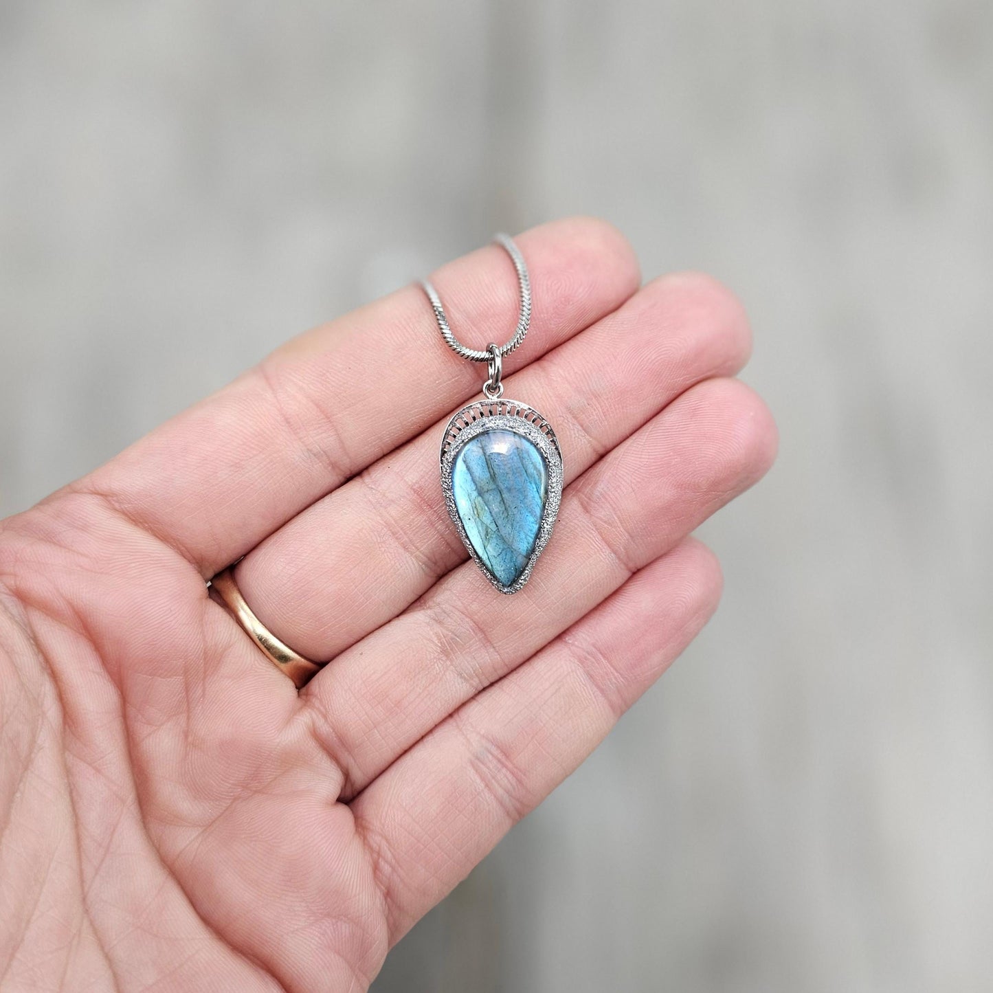 Handmade labradorite pendant necklace with a short stainless steel chain. Features a unique polymer clay setting. One of a kind magical jewelry, perfect gift for her.