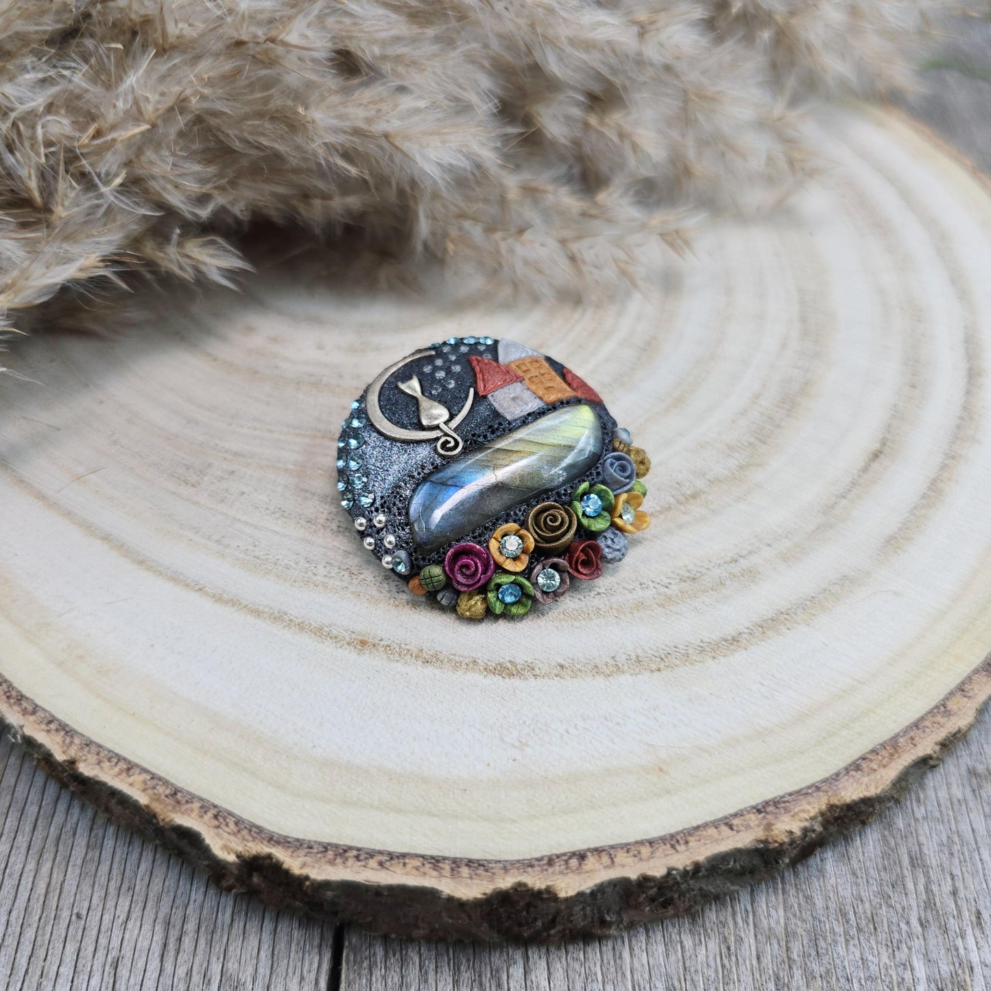 Handmade polymer clay brooch with labradorite and metal cat – magical, nature-inspired accessory for cat lovers.