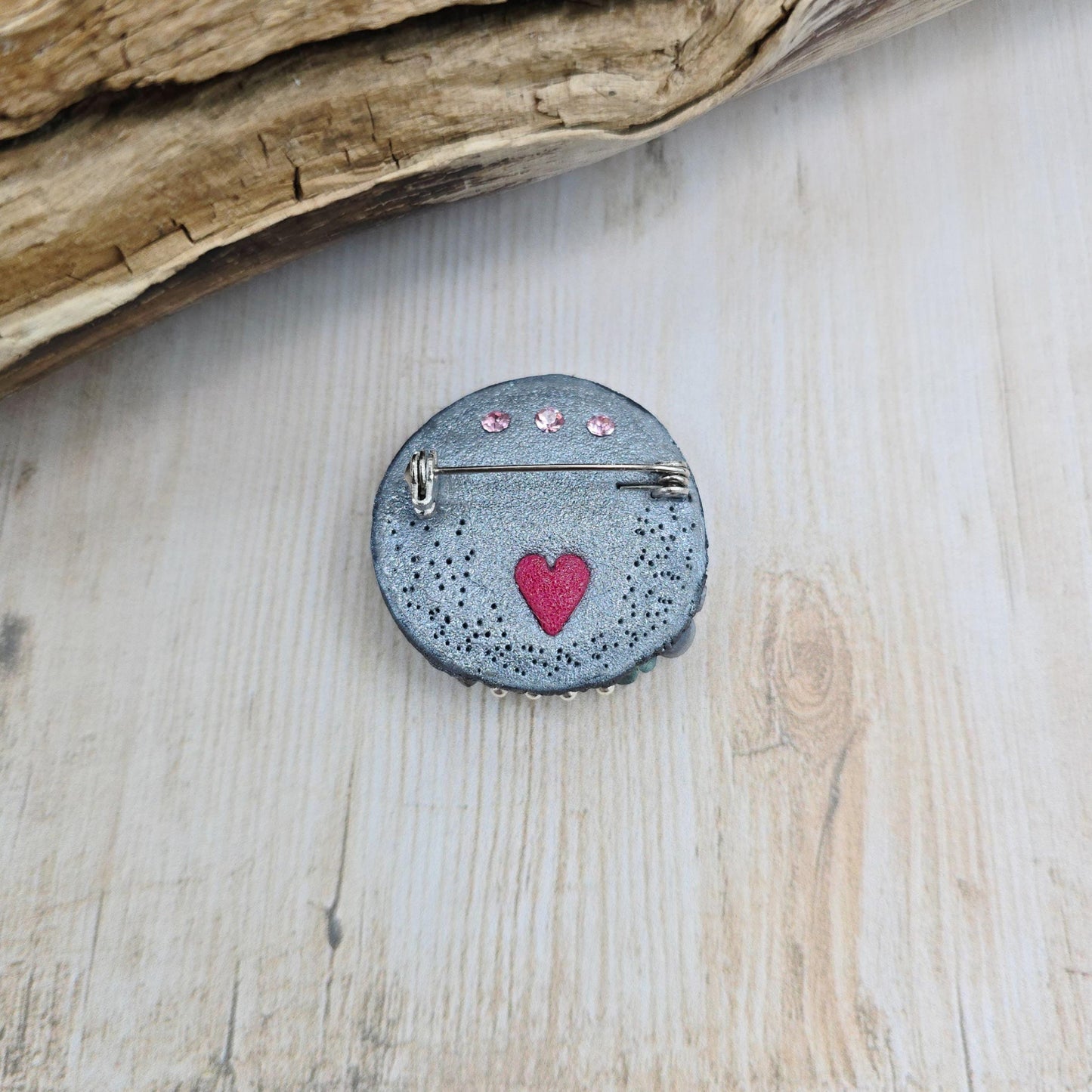 Handmade polymer clay brooch featuring a magical mushroom and a glowing labradorite stone, with stainless steel pin – forest-inspired mystical jewelry.