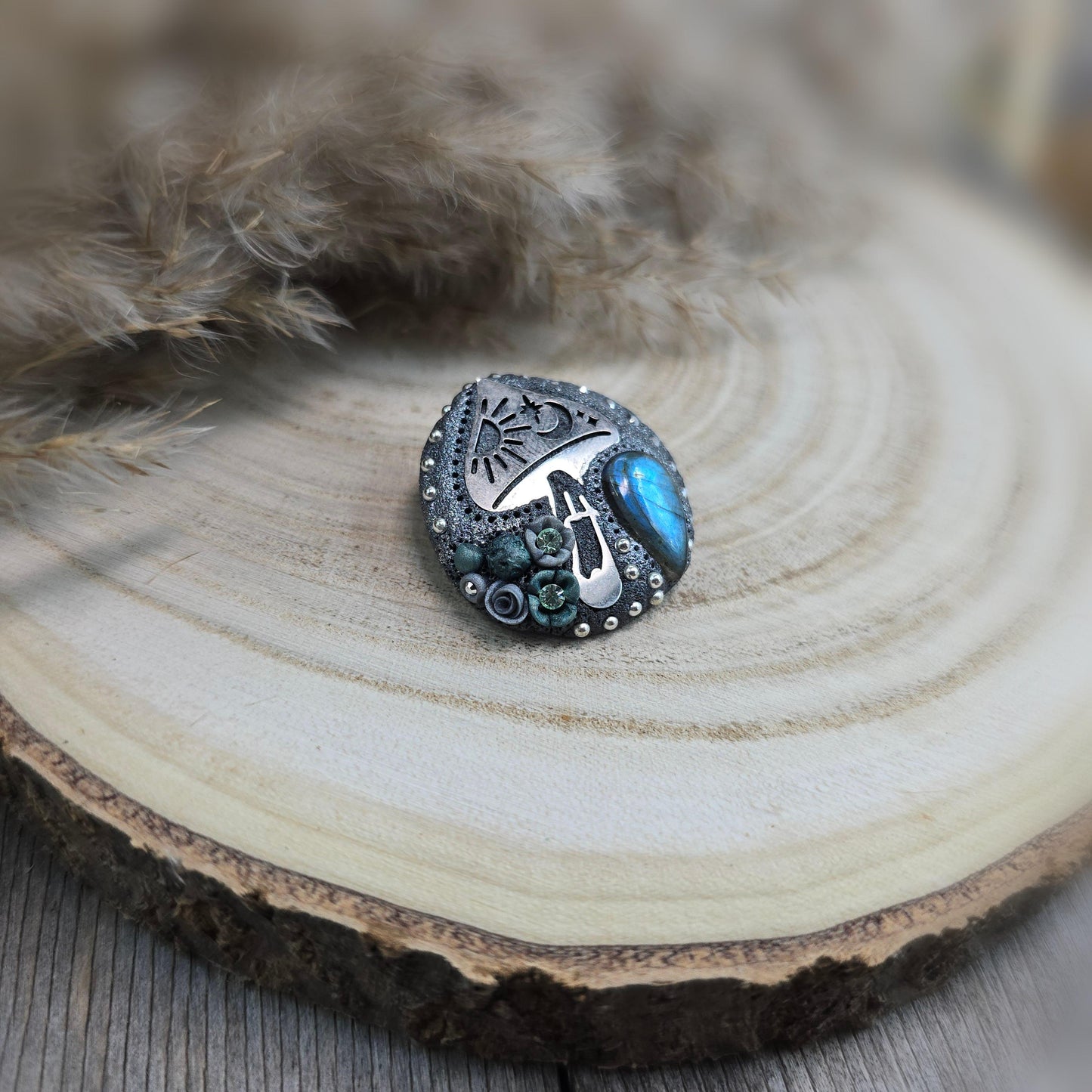 Handmade polymer clay brooch featuring a magical mushroom and a glowing labradorite stone, with stainless steel pin – forest-inspired mystical jewelry.